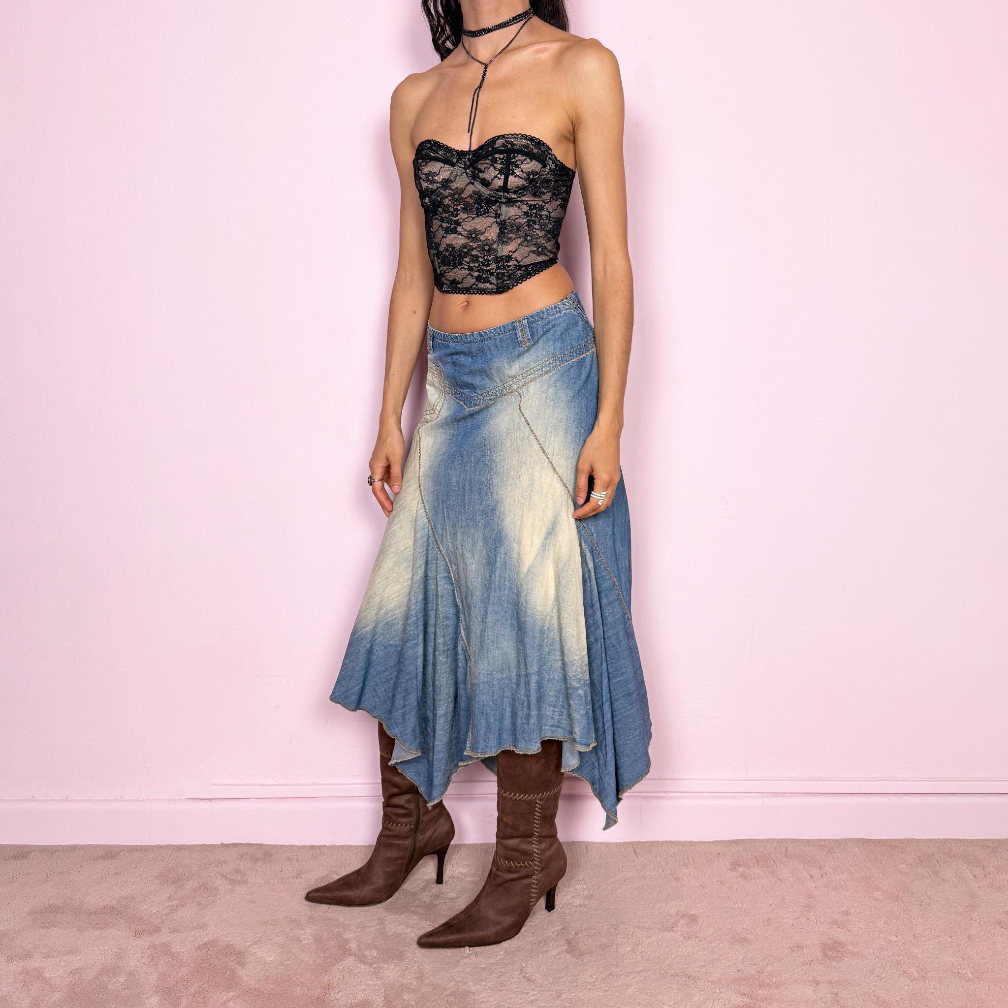 Vintage 2000s blue denim midi skirt with an avant garde flared asymmetric silhouette and panelled construction. Features a soft faded wash, raw hem detailing, and side zip closure, no stretch. Unique bold design perfect for summer festival styling. Can be worn high waisted for size M or mid to low rise for XS/S. Great vintage condition.