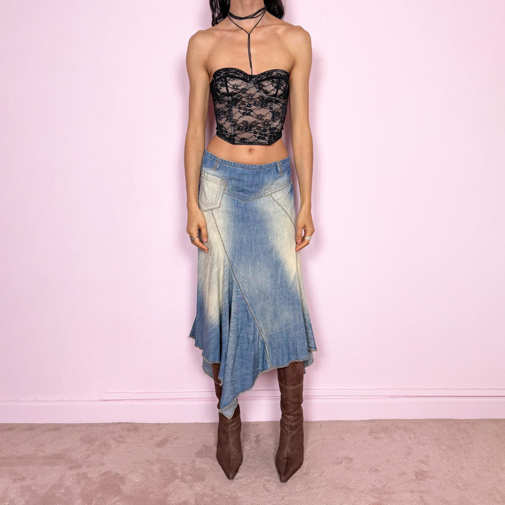 Vintage 2000s blue denim midi skirt with an avant garde flared asymmetric silhouette and panelled construction. Features a soft faded wash, raw hem detailing, and side zip closure, no stretch. Unique bold design perfect for summer festival styling. Can be worn high waisted for size M or mid to low rise for XS/S. Great vintage condition.