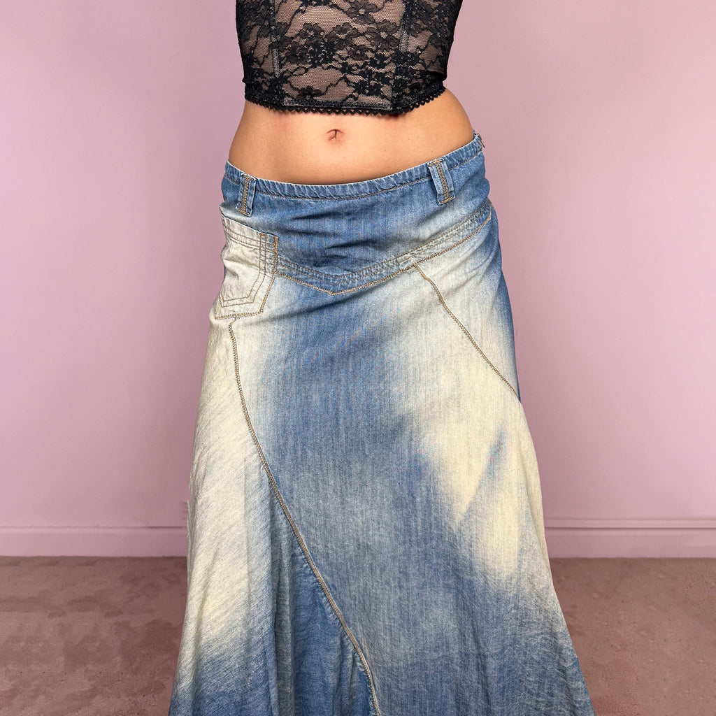 Vintage 2000s blue denim midi skirt with an avant garde flared asymmetric silhouette and panelled construction. Features a soft faded wash, raw hem detailing, and side zip closure, no stretch. Unique bold design perfect for summer festival styling. Can be worn high waisted for size M or mid to low rise for XS/S. Great vintage condition.
