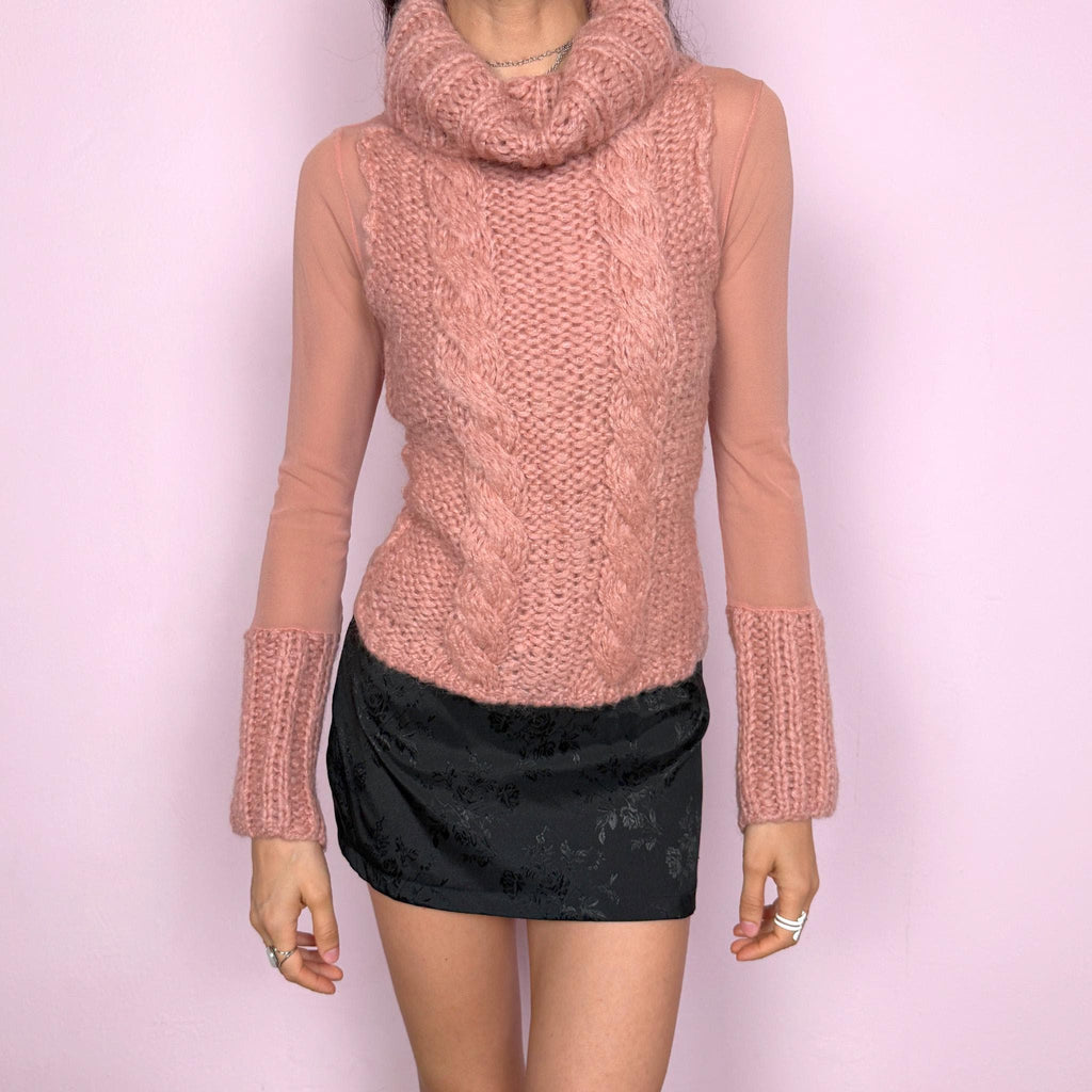 Vintage 2000s avant garde bi-material pink top with a turtleneck, cuffs, and cable knit front crafted from 40% mohair, 30% wool, and 20% acrylic, combined with semi sheer mesh polyamide panels. Stretchy with a fitted silhouette, blending soft coquette aesthetics with a unique deconstructed design. Made in Italy. Excellent vintage condition.
