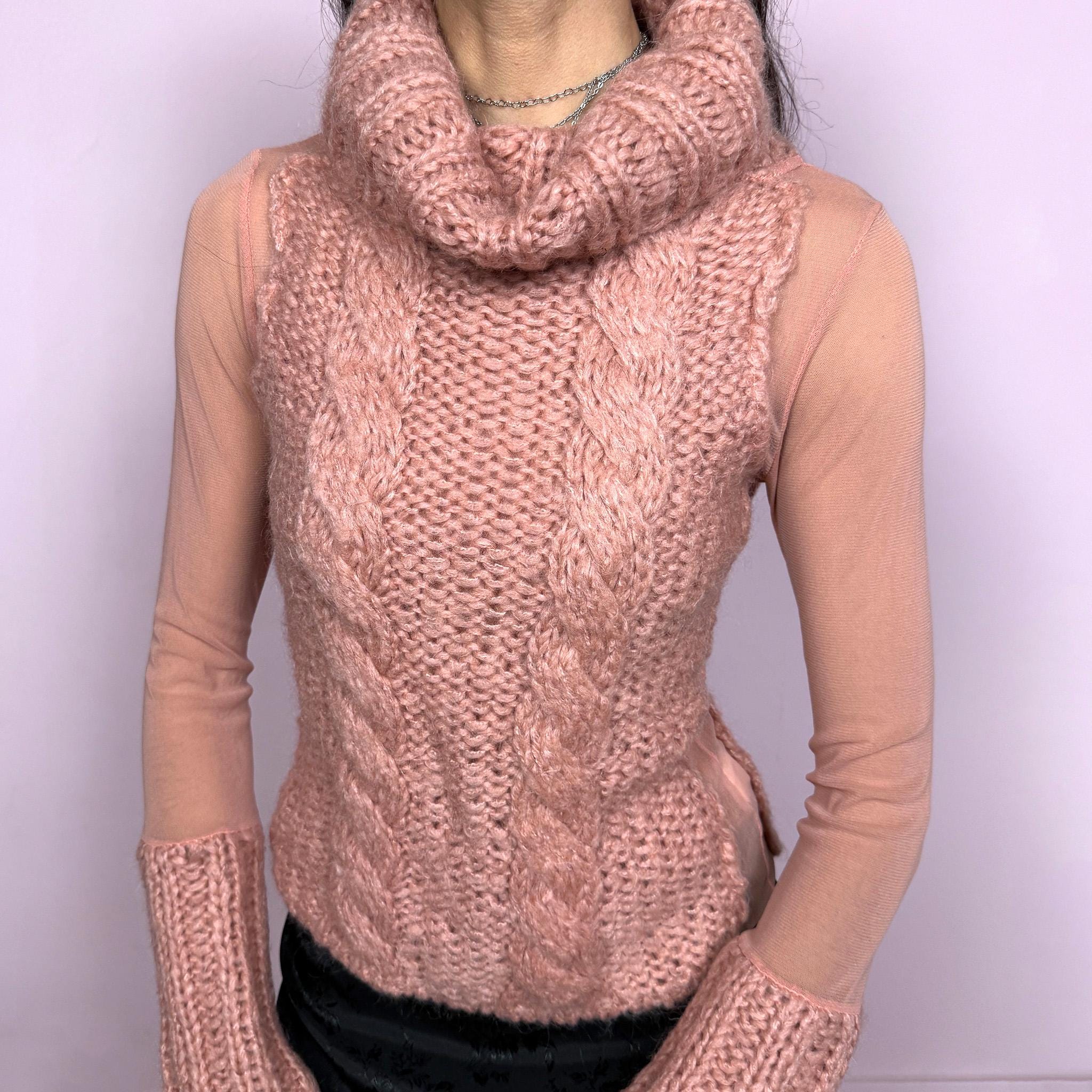 Vintage 2000s avant garde bi-material pink top with a turtleneck, cuffs, and cable knit front crafted from 40% mohair, 30% wool, and 20% acrylic, combined with semi sheer mesh polyamide panels. Stretchy with a fitted silhouette, blending soft coquette aesthetics with a unique deconstructed design. Made in Italy. Excellent vintage condition.