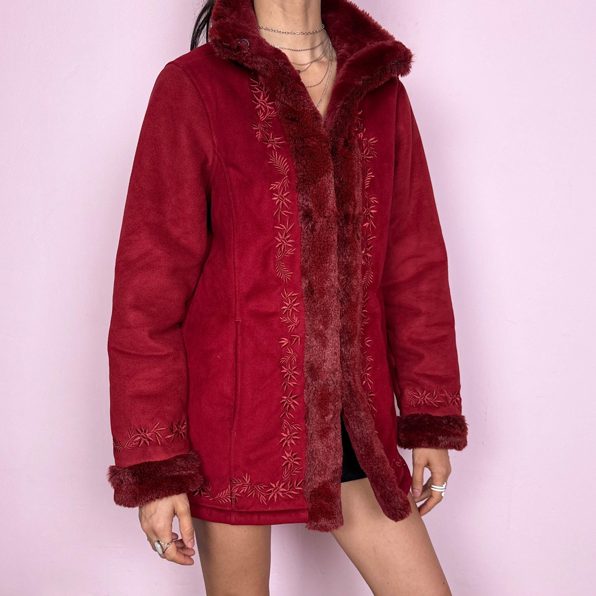 Vintage 2000s Penny Lane style coat in a deep red tone featuring rich embroidery and plush faux fur trim at the collar, cuffs, and interior. Designed with a cozy structured fit, pockets, and hook closure for a bold bohemian statement. Perfect for winter with a soft fairycore feel. Made from a polyester acrylic blend. Excellent vintage condition.