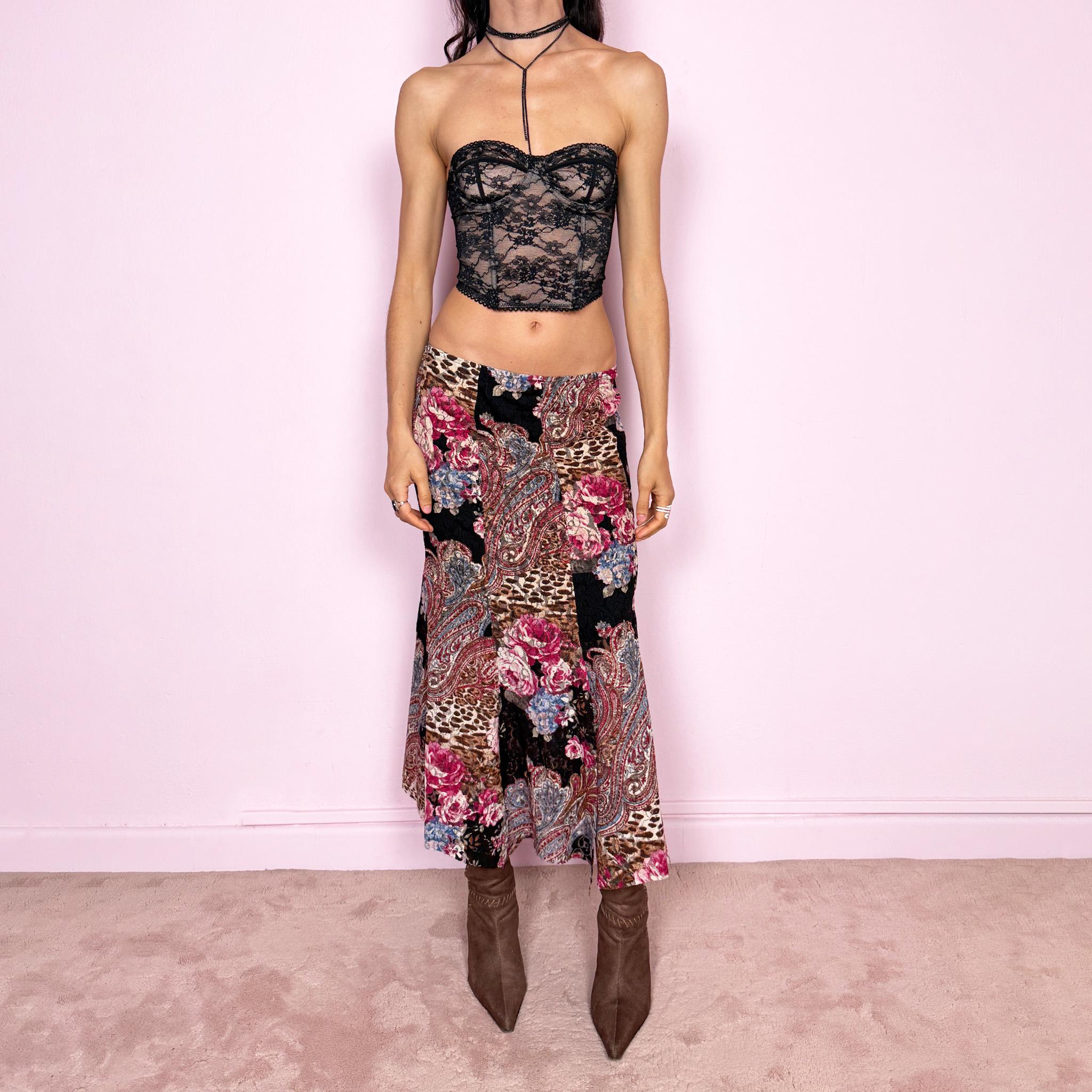 Vintage 2000s lace midi skirt with a whimsical maximalist mix of floral, paisley, and animal prints. Features multiple split hems and a stretchy elastic waistband for a flexible fit. Can be worn high waisted for size S or mid to low rise for XS. Made from a microfiber blend. Great vintage condition.