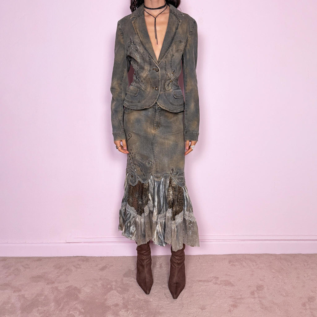 Vintage 2000s green-gray denim set with a faded tie-dye effect, including a tailored blazer-style jacket and matching mid-rise midi skirt. Both pieces are slightly stretchy and embellished with beads and rhinestones. The skirt features a dramatic trumpet ruffle mixed-fabric hem for a striking silhouette. Iconic statement Y2K set. Made from 95% cotton and 5% spandex. Excellent vintage condition.