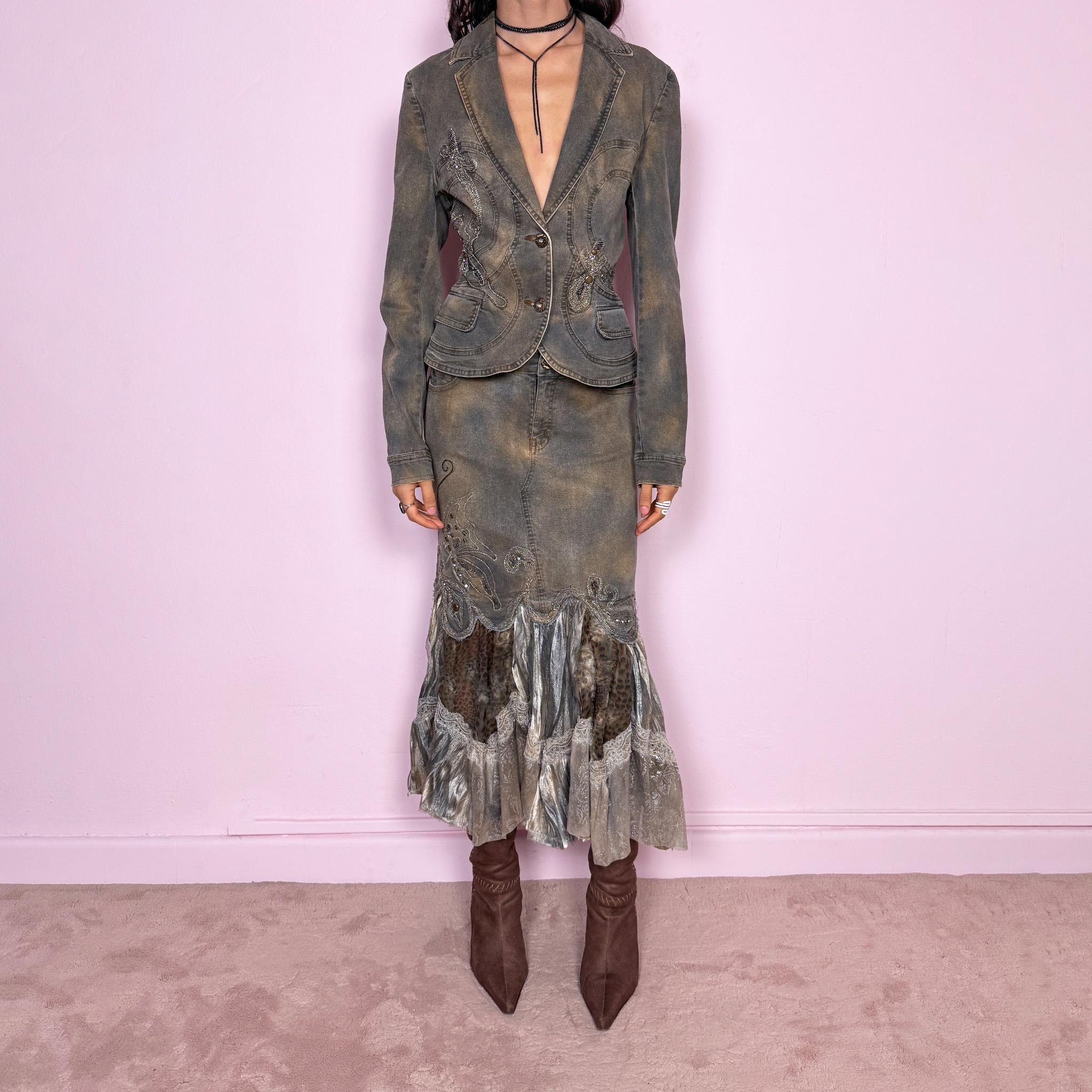 Vintage 2000s green-gray denim set with a faded tie-dye effect, including a tailored blazer-style jacket and matching mid-rise midi skirt. Both pieces are slightly stretchy and embellished with beads and rhinestones. The skirt features a dramatic trumpet ruffle mixed-fabric hem for a striking silhouette. Iconic statement Y2K set. Made from 95% cotton and 5% spandex. Excellent vintage condition.