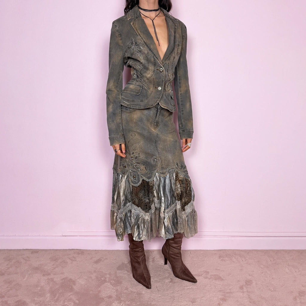 Vintage 2000s green-gray denim set with a faded tie-dye effect, including a tailored blazer-style jacket and matching mid-rise midi skirt. Both pieces are slightly stretchy and embellished with beads and rhinestones. The skirt features a dramatic trumpet ruffle mixed-fabric hem for a striking silhouette. Iconic statement Y2K set. Made from 95% cotton and 5% spandex. Excellent vintage condition.