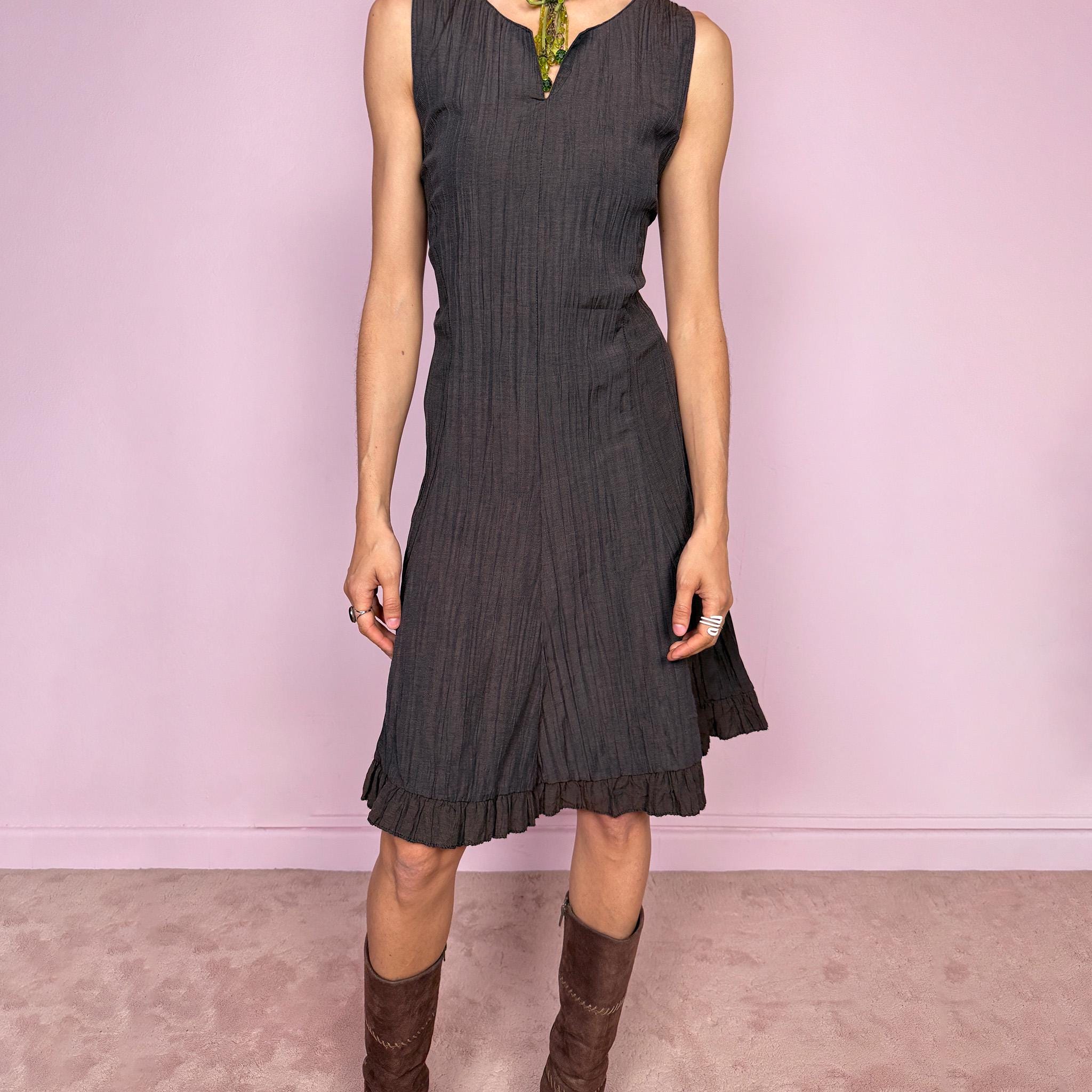 Vintage 2000s dark brown sleeveless midi dress with a crinkle texture and sleek fitted silhouette. Features a soft ruffle hem and back zip closure with a non-stretch fit. Moody avant-garde fairy styling, perfect for spring summer wear, effortless daytime looks, or elevated evening dressing. Made in France by a French brand. Great vintage condition.