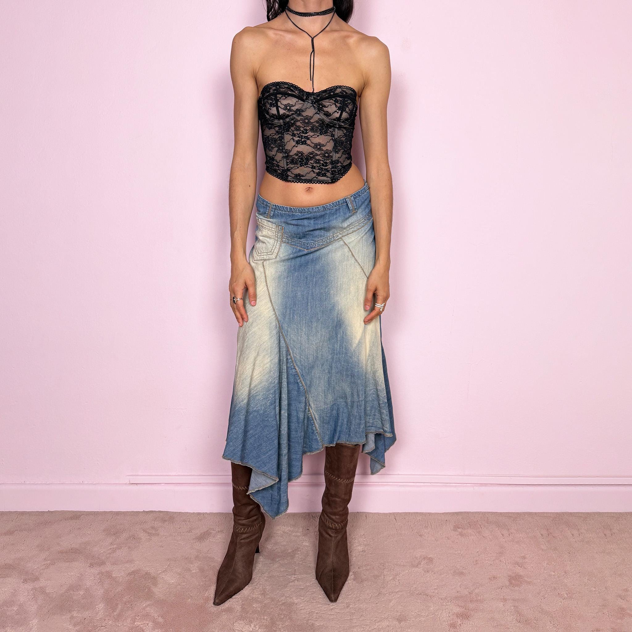 Vintage 2000s blue denim midi skirt with an avant garde flared asymmetric silhouette and panelled construction. Features a soft faded wash, raw hem detailing, and side zip closure, no stretch. Unique bold design perfect for summer festival styling. Can be worn high waisted for size M or mid to low rise for XS/S. Great vintage condition.