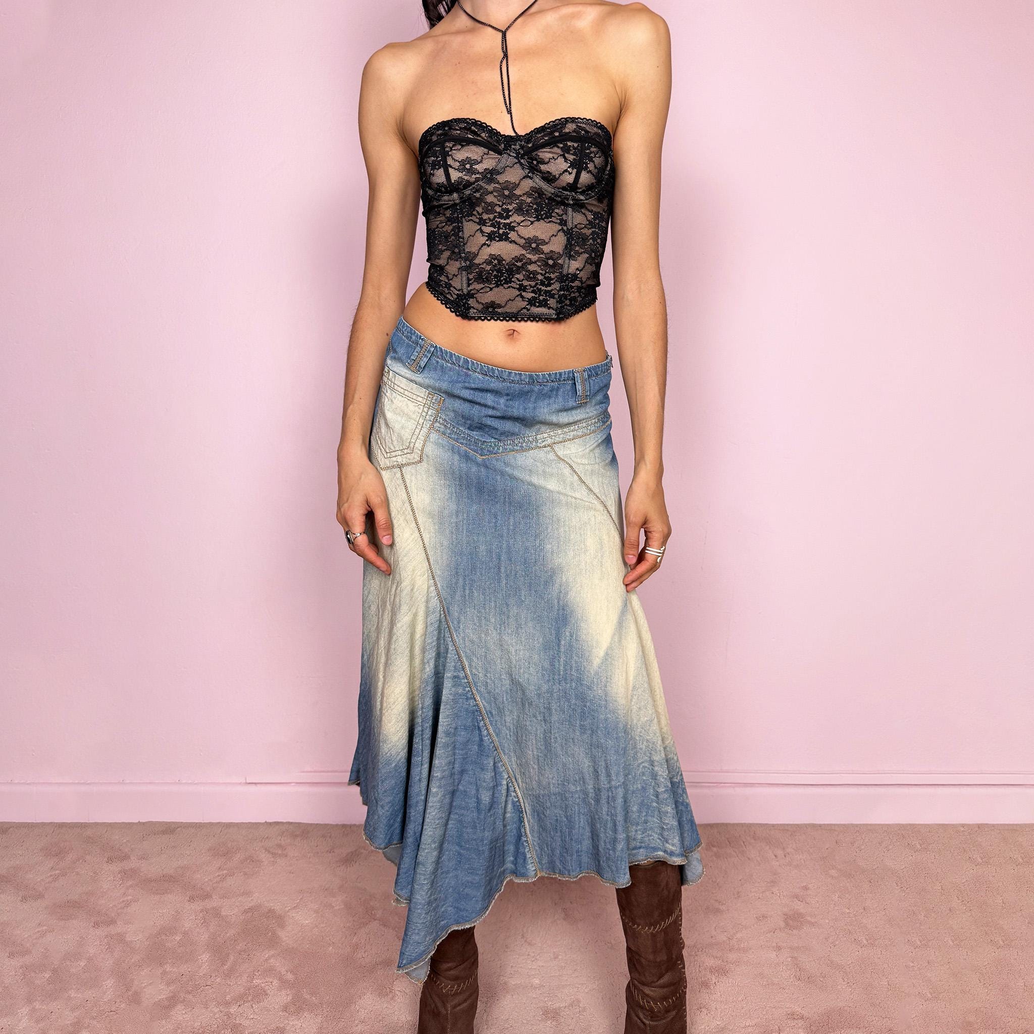 Vintage 2000s blue denim midi skirt with an avant garde flared asymmetric silhouette and panelled construction. Features a soft faded wash, raw hem detailing, and side zip closure, no stretch. Unique bold design perfect for summer festival styling. Can be worn high waisted for size M or mid to low rise for XS/S. Great vintage condition.