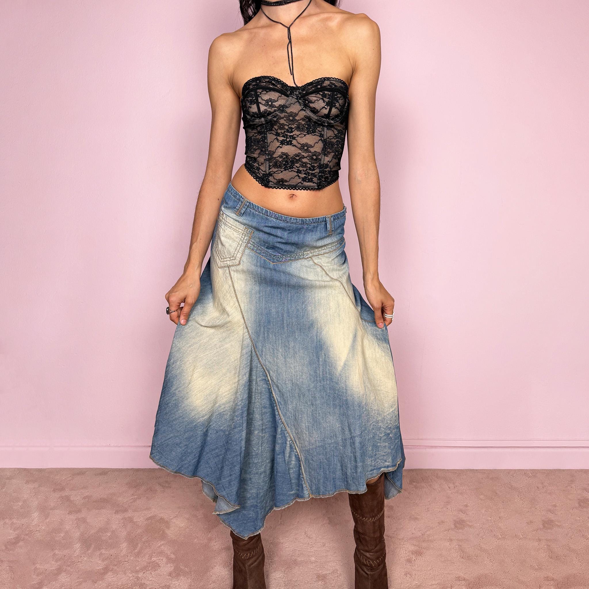 Vintage 2000s blue denim midi skirt with an avant garde flared asymmetric silhouette and panelled construction. Features a soft faded wash, raw hem detailing, and side zip closure, no stretch. Unique bold design perfect for summer festival styling. Can be worn high waisted for size M or mid to low rise for XS/S. Great vintage condition.