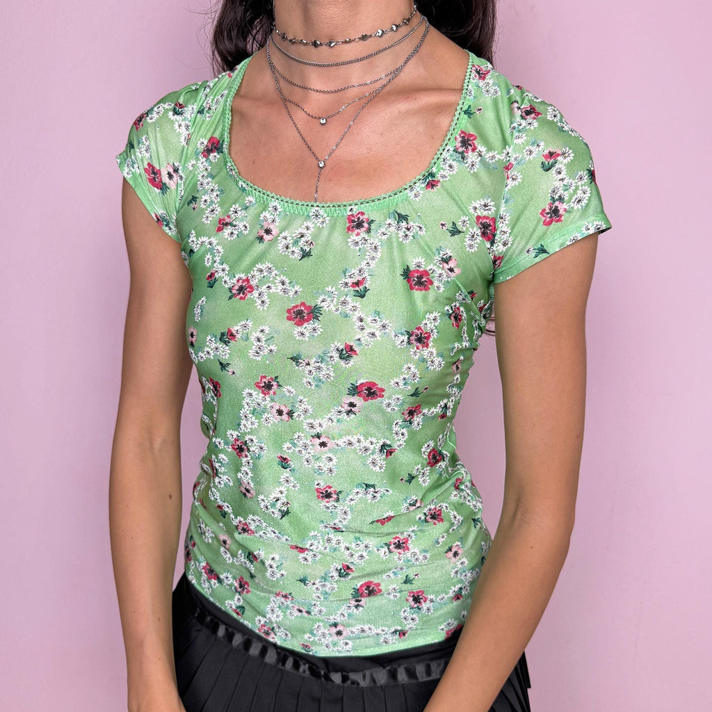 Vintage 2000s dreamy fitted stretchy top in pastel green with floral print throughout by Just Cavalli Underwear. Scoop neckline, short sleeves, body-skimming fit and a dramatic open cut out back. Soft coquette prairie aesthetic, perfect for summer styling. Made from a polyamide elastane blend. Excellent vintage condition.