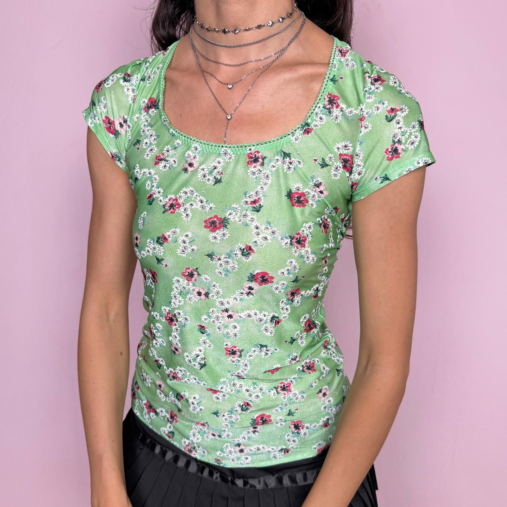 Vintage 2000s dreamy fitted stretchy top in pastel green with floral print throughout by Just Cavalli Underwear. Scoop neckline, short sleeves, body-skimming fit and a dramatic open cut out back. Soft coquette prairie aesthetic, perfect for summer styling. Made from a polyamide elastane blend. Excellent vintage condition.