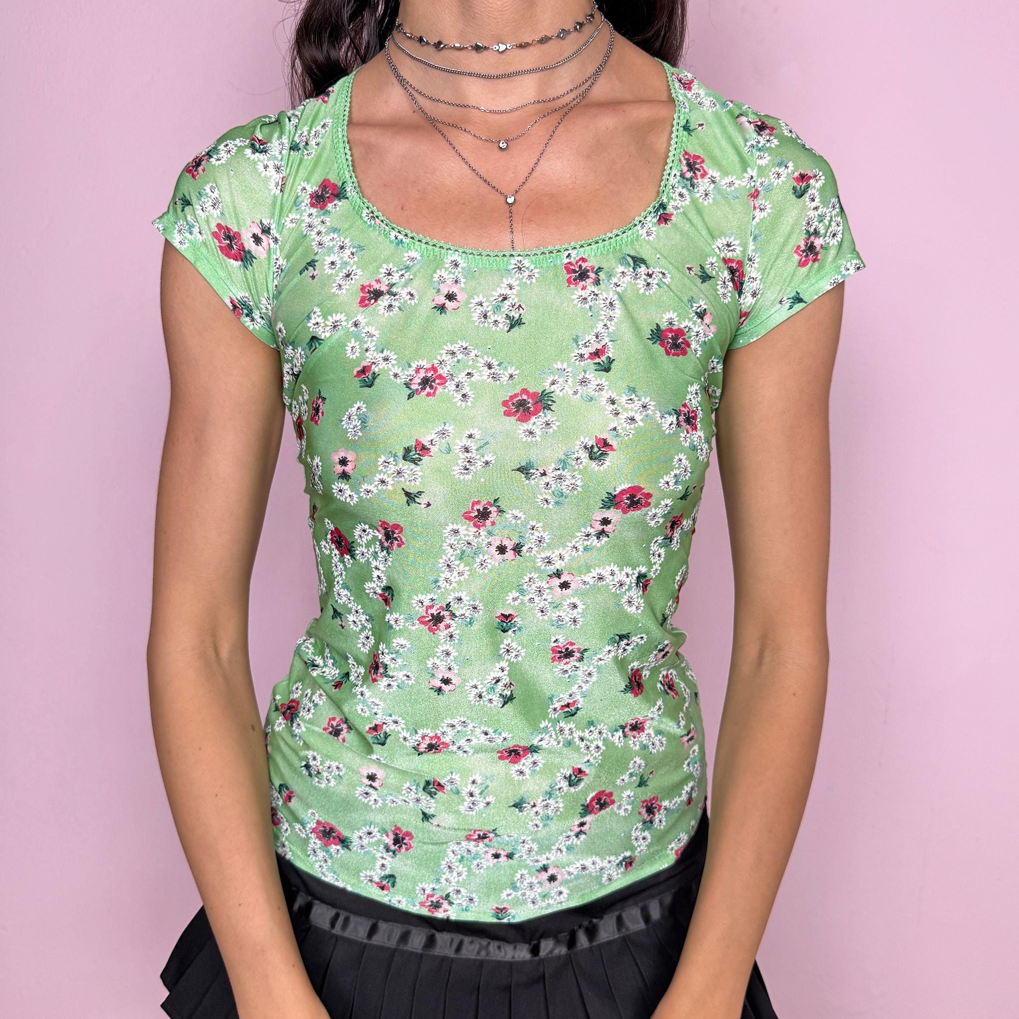 Vintage 2000s dreamy fitted stretchy top in pastel green with floral print throughout by Just Cavalli Underwear. Scoop neckline, short sleeves, body-skimming fit and a dramatic open cut out back. Soft coquette prairie aesthetic, perfect for summer styling. Made from a polyamide elastane blend. Excellent vintage condition.