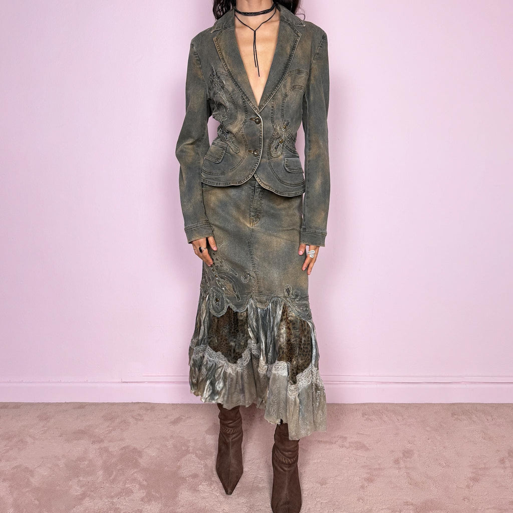 Vintage 2000s green-gray denim set with a faded tie-dye effect, including a tailored blazer-style jacket and matching mid-rise midi skirt. Both pieces are slightly stretchy and embellished with beads and rhinestones. The skirt features a dramatic trumpet ruffle mixed-fabric hem for a striking silhouette. Iconic statement Y2K set. Made from 95% cotton and 5% spandex. Excellent vintage condition.