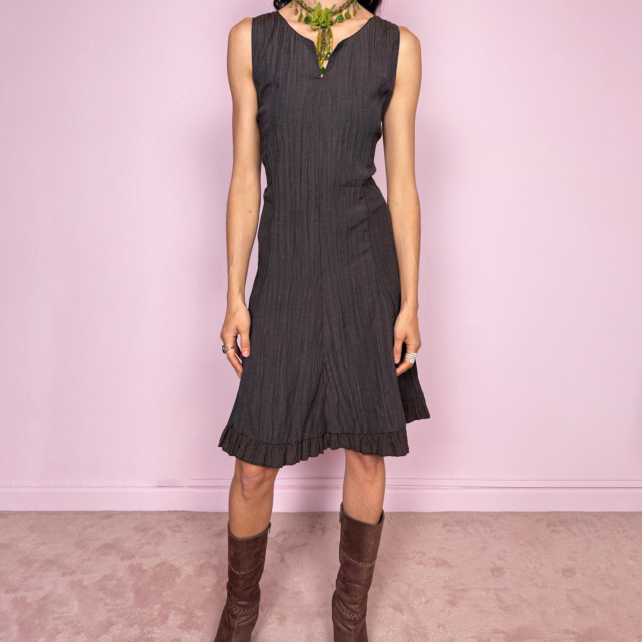 Vintage 2000s dark brown sleeveless midi dress with a crinkle texture and sleek fitted silhouette. Features a soft ruffle hem and back zip closure with a non-stretch fit. Moody avant-garde fairy styling, perfect for spring summer wear, effortless daytime looks, or elevated evening dressing. Made in France by a French brand. Great vintage condition.