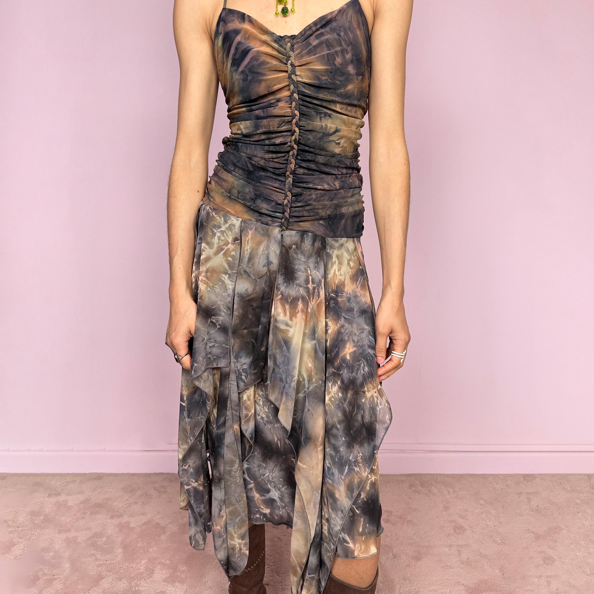 Vintage 2000s multicolored halter midi dress with a tie-neck design and ruched stretchy bodice for a flattering fitted silhouette. Features a dramatic asymmetric handkerchief hem and bold psychedelic tie-dye print in earthy tones. Stunning statement piece perfect for festivals, boho fairy styling, or summer events. Made in USA from polyester. Excellent vintage condition.