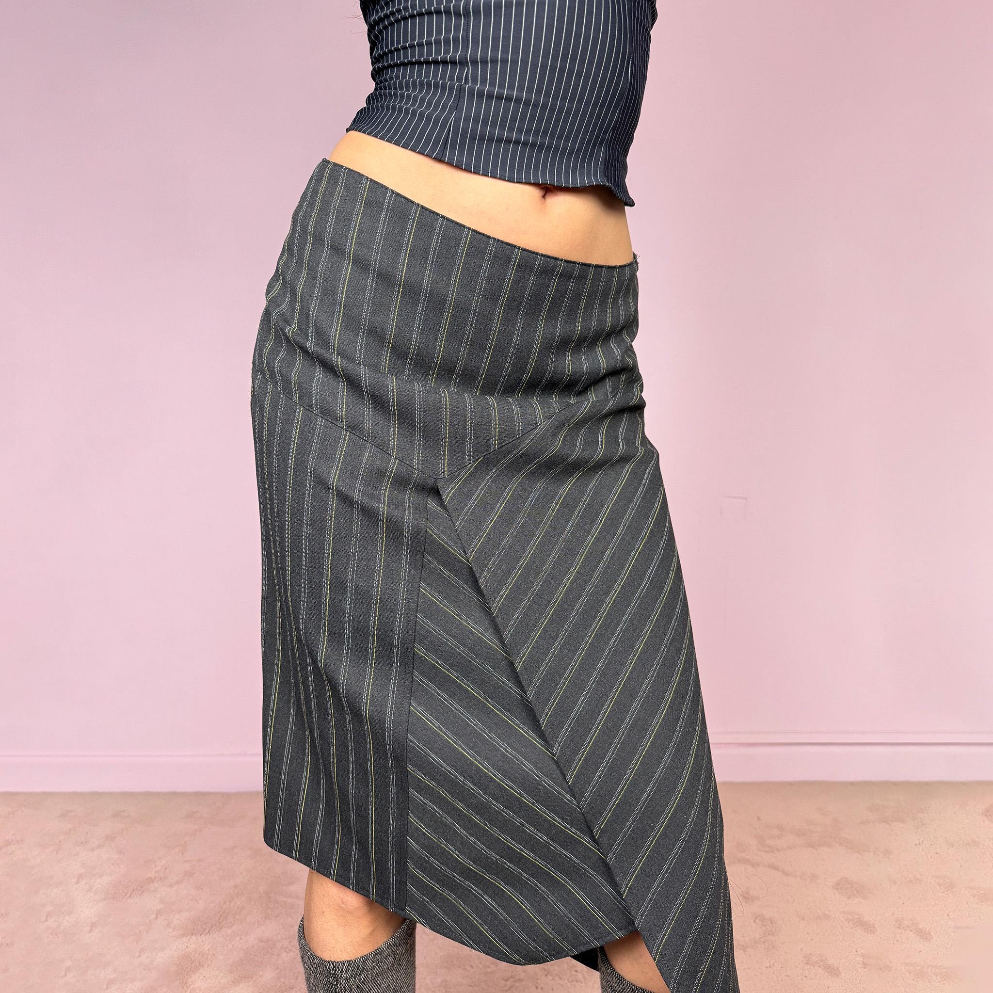 Vintage 2000s dark gray pinstripe midi skirt with a deconstructed avant-garde formal office look. Features an asymmetric layered front, pointed hem, structured no-stretch fit, and side zip closure. Can be worn mid rise for size S or lower rise for size XS. Excellent vintage condition.