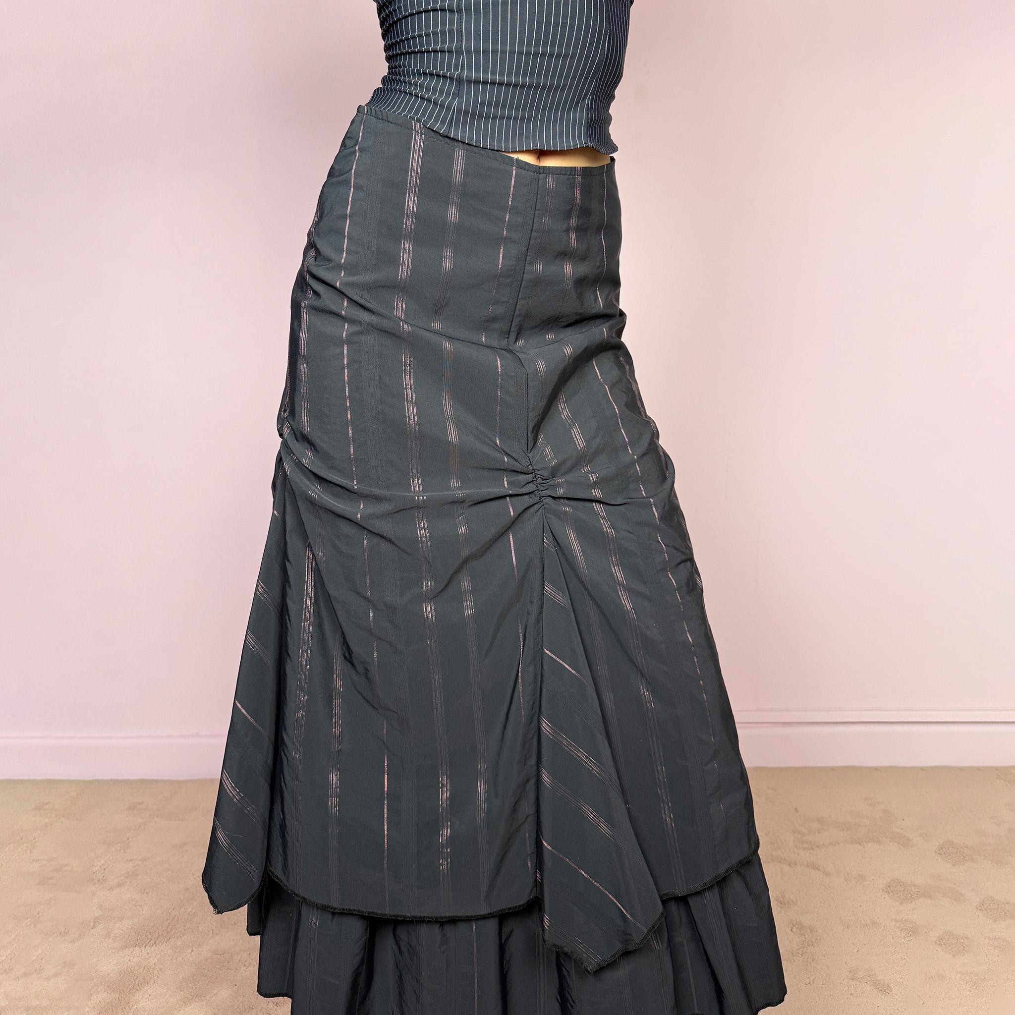 Vintage 2000s black midi skirt with pink pinstripes, a layered deconstructed silhouette, ruched details, and ruffled hem. This dark avant-garde piece has a structured no-stretch fit with back zip closure. Can be worn high waisted for size S or lower rise for XXS and XS. Made in France from a cotton, polyamide, and polyester blend. Great vintage condition.