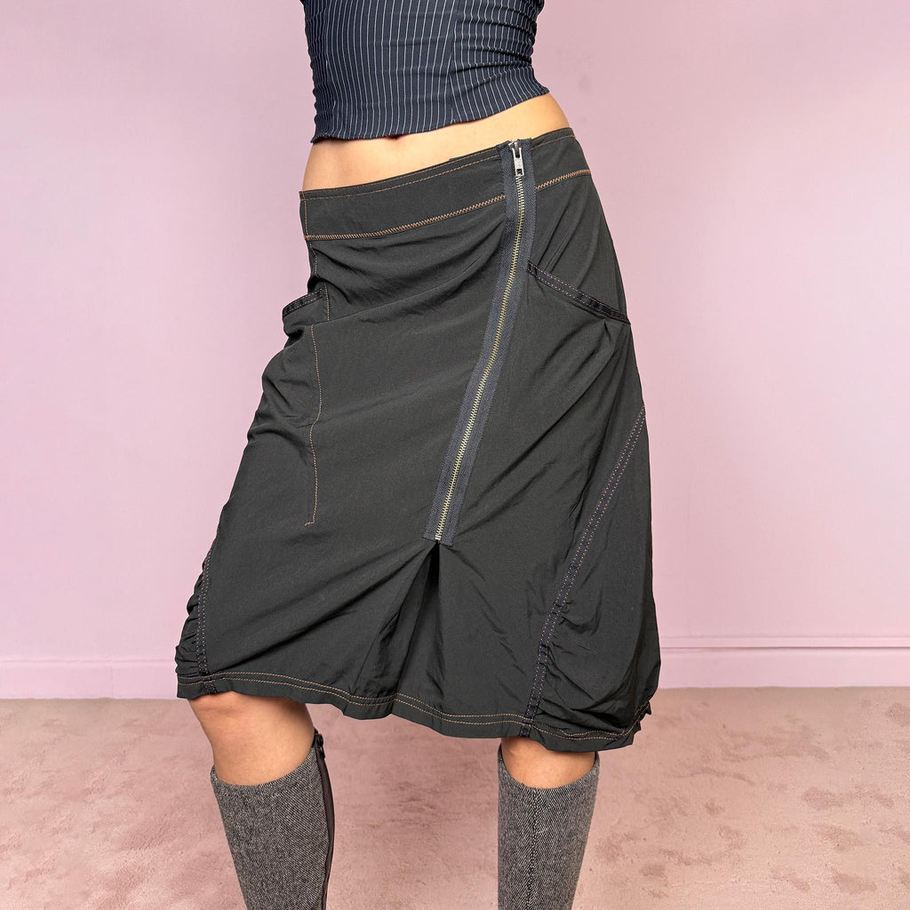 Vintage 2000s lightweight black midi skirt with a dark avant-garde dystopian techwear look. Features pockets, an asymmetric front zip closure, ruched details, contrast topstitching, and a bubble hem effect. No stretch. Can be worn mid rise for size L or lower rise for size M. Great vintage condition.