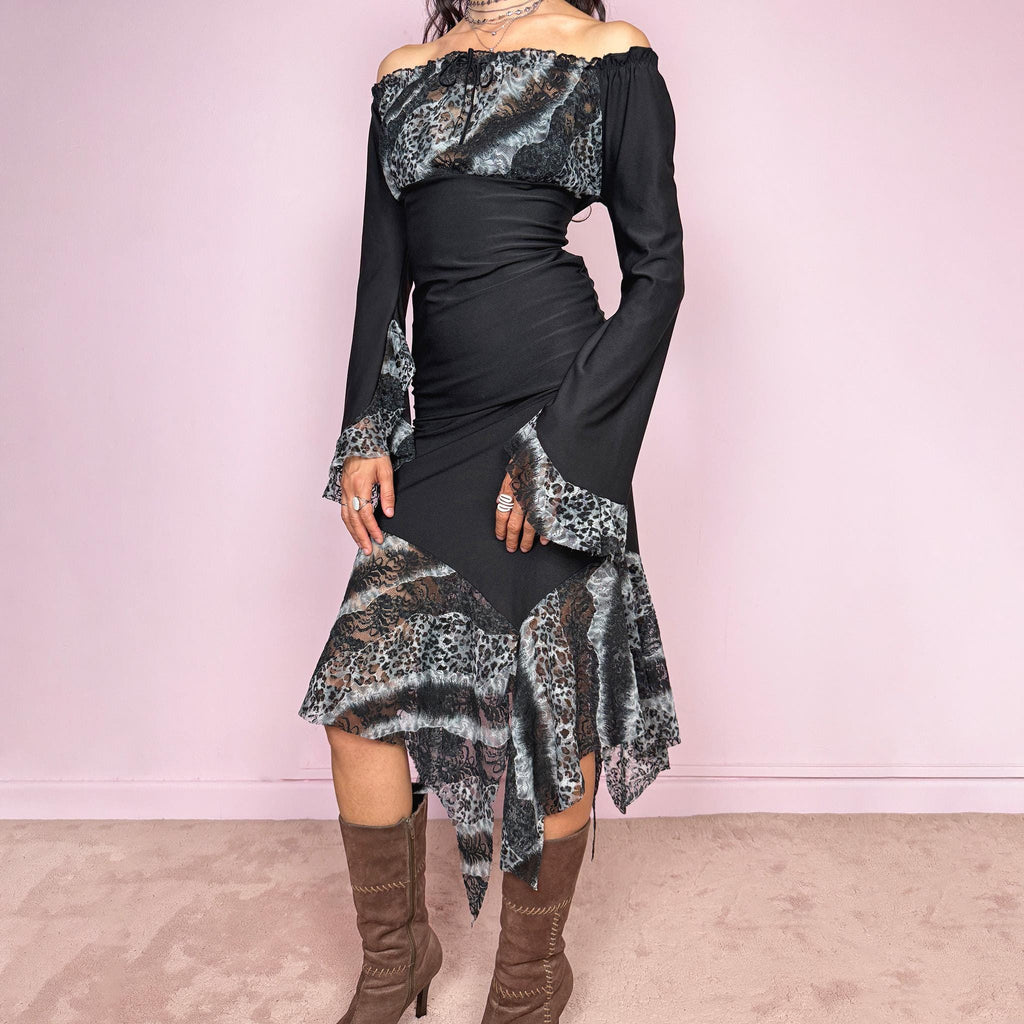Vintage 2000s black two piece set with an elastic waist midi skirt, asymmetrical hem, and matching off shoulder blouse with 3/4 bell sleeves, ruffle cuffs, tie neckline, and semi-sheer gray leopard mesh bust panel. Whimsical dark fairy look. Made in France from a polyester elastane blend. Excellent vintage condition.