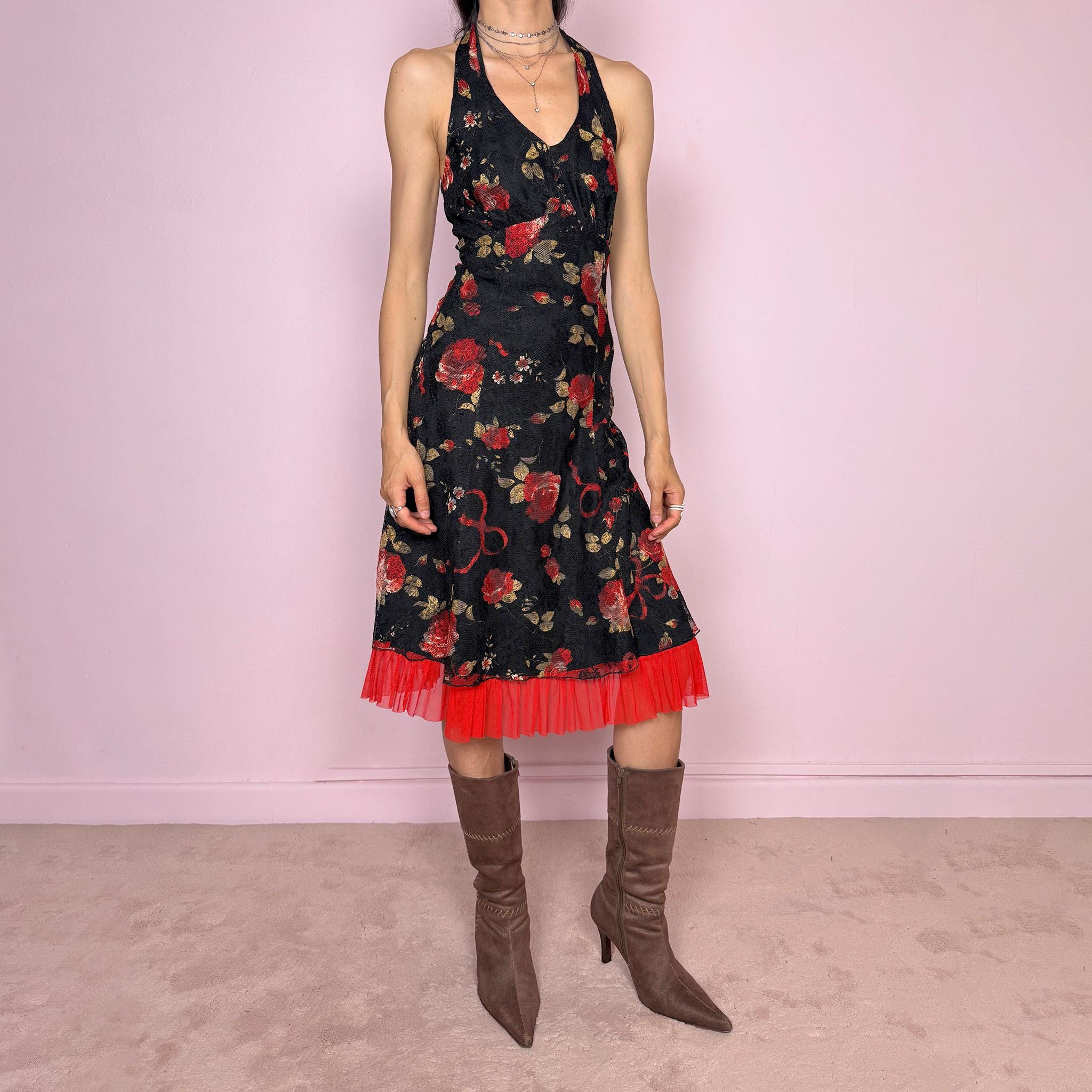 Vintage 2000s black halter tie-neck midi dress with a stretchy fit, V-neckline, backless cut, and side zip closure. Features black lining, a lace mesh overlay with rose print, and a dreamy red ruffle mesh hem. Romantic, feminine, and elegant for summer. Excellent vintage condition.
