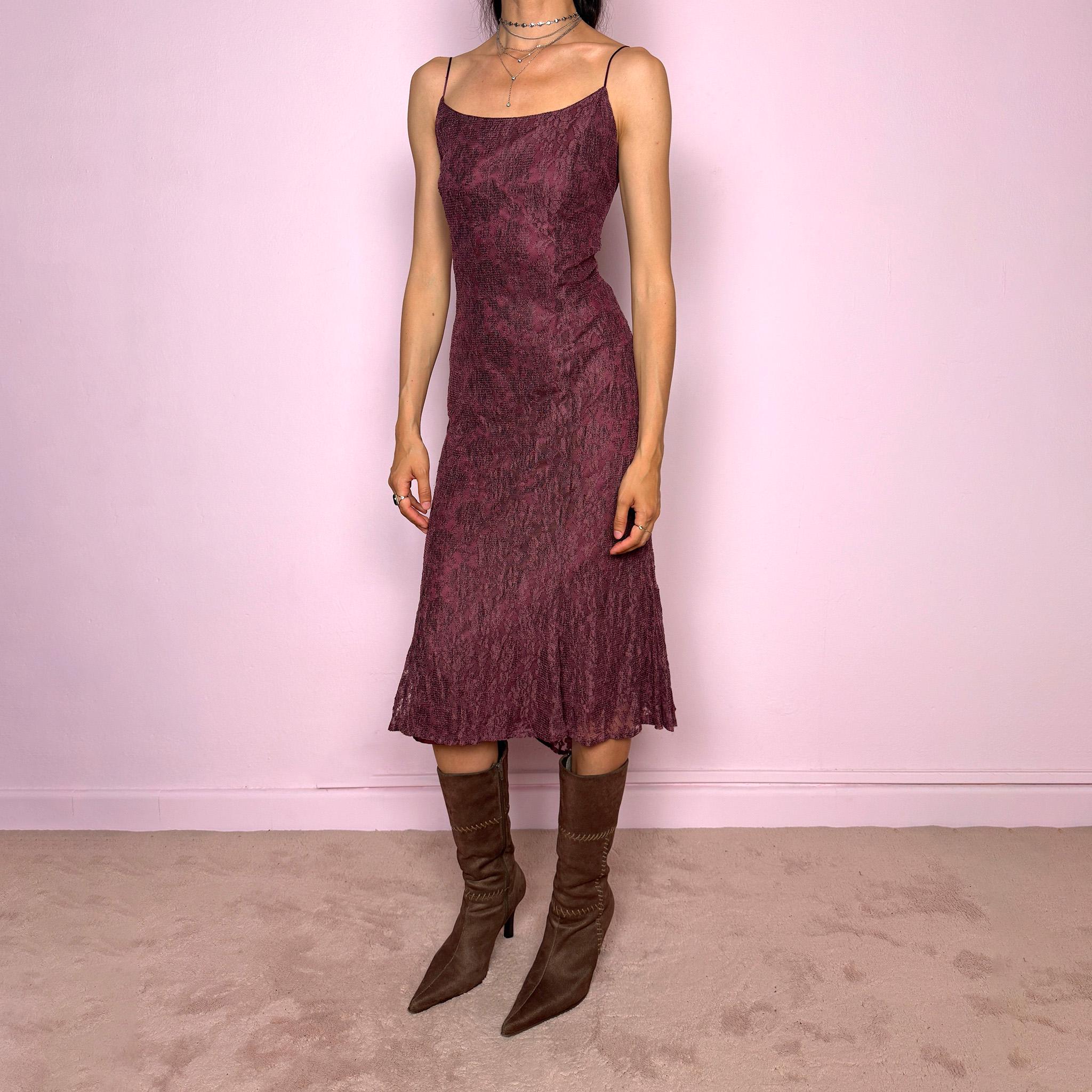 Vintage 2000s burgundy-purple midi slip dress featuring thin straps, a fitted body-skimming silhouette, and a lace overlay. Designed with a back zip closure, no stretch, and a slightly longer hem at the back for a soft, elegant drape. Made with a viscose-polyamide outer layer and polyester lining. A romantic minimal statement Y2K dress, perfect as an elevated evening piece. Excellent vintage condition.