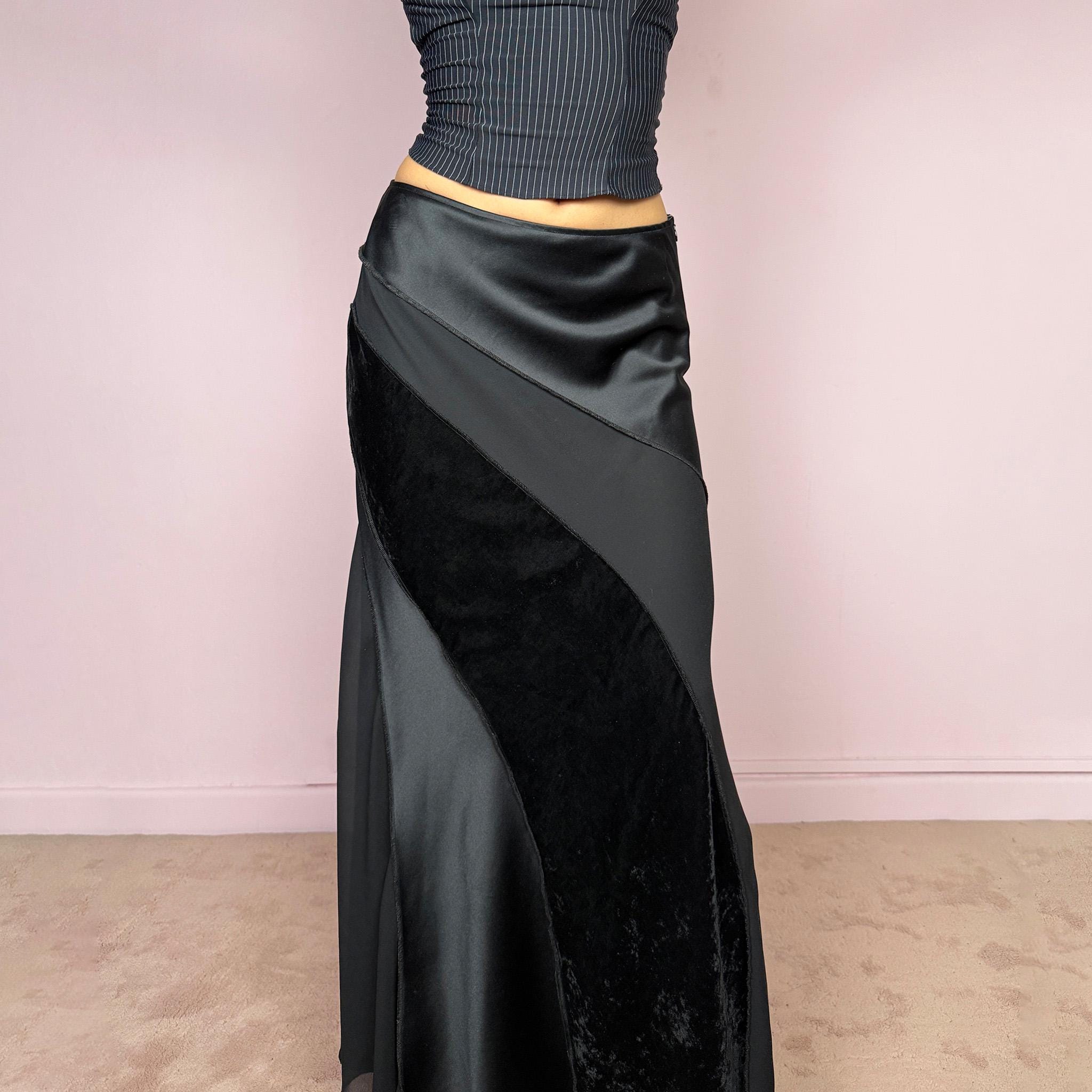 Vintage 2000s black midi skirt with a formal avant-garde minimal look, mixed velvet, satin, and sheer flare panels, asymmetric diagonal construction, side zip closure, and structured no-stretch fit. Elegant statement piece for evening, night, or event styling. Can be worn high waisted for S or lower rise for XS/XXS. Made from polyester. Excellent vintage condition.
