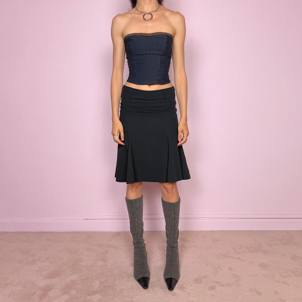 Vintage 2000s classic black midi skirt with a formal romantic feel. Features a sleek trumpet godet silhouette, side zip closure, belt loops, and a structured no-stretch fit. Perfect for elevated everyday or minimal styling. Can be worn mid rise for size XS or lower rise for XXS. Made in France from polyester, viscose, and elastane. Great vintage condition.