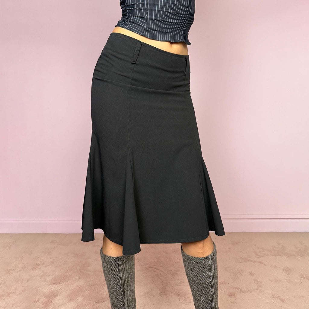 Vintage 2000s classic black midi skirt with a formal romantic feel. Features a sleek trumpet godet silhouette, side zip closure, belt loops, and a structured no-stretch fit. Perfect for elevated everyday or minimal styling. Can be worn mid rise for size XS or lower rise for XXS. Made in France from polyester, viscose, and elastane. Great vintage condition.