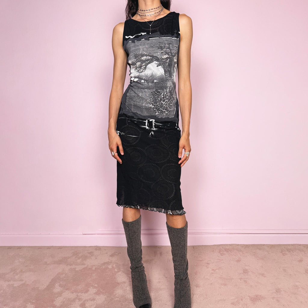 Vintage 2000s black semi-sheer mesh midi dress with a dark avant-garde deconstructed look. Sleeveless and stretchy with an abstract graphic print, mixed mesh paneling and a fitted silhouette. Made from polyamide and polyester. Great vintage condition.