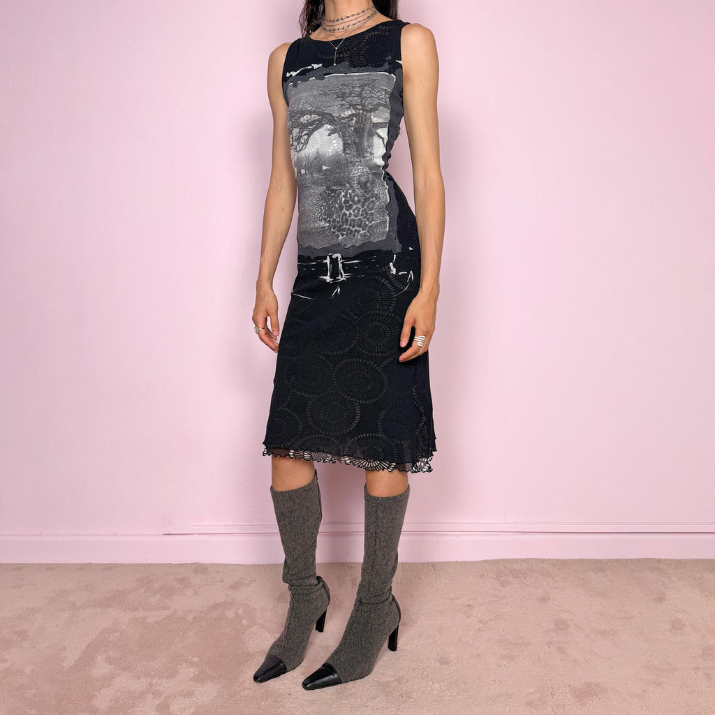 Vintage 2000s black semi-sheer mesh midi dress with a dark avant-garde deconstructed look. Sleeveless and stretchy with an abstract graphic print, mixed mesh paneling and a fitted silhouette. Made from polyamide and polyester. Great vintage condition.