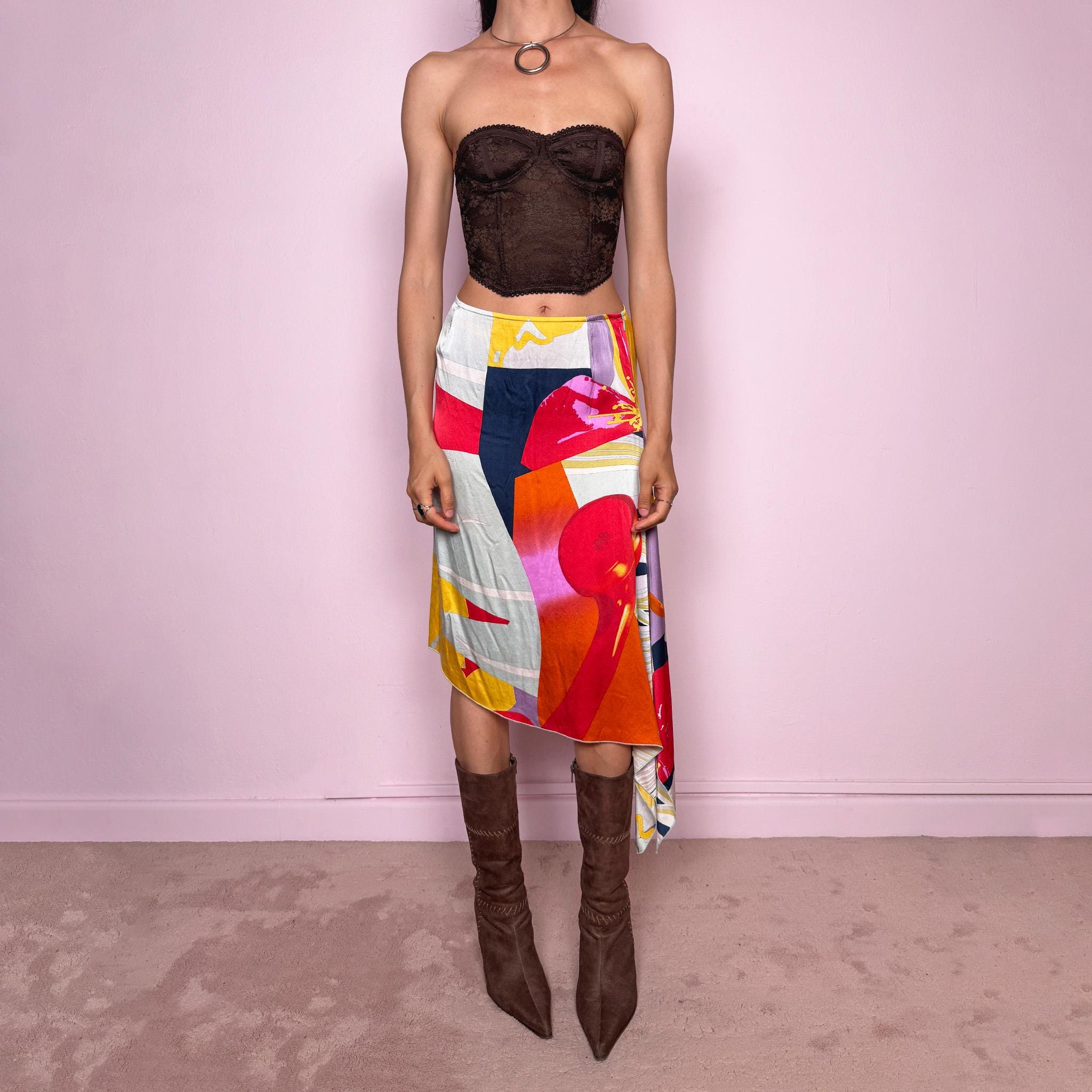 Vintage 2000s Christian Lacroix Bazar asymmetric skirt made in France from 100% silk. Features a bold multicolor abstract print, side zip closure, no stretch, and a beautiful asymmetric draped hem. A rare designer statement piece with an artistic Y2K resort feel, perfect for elevated summer looks. Can be worn high-waisted for size S or lower-rise for XS.