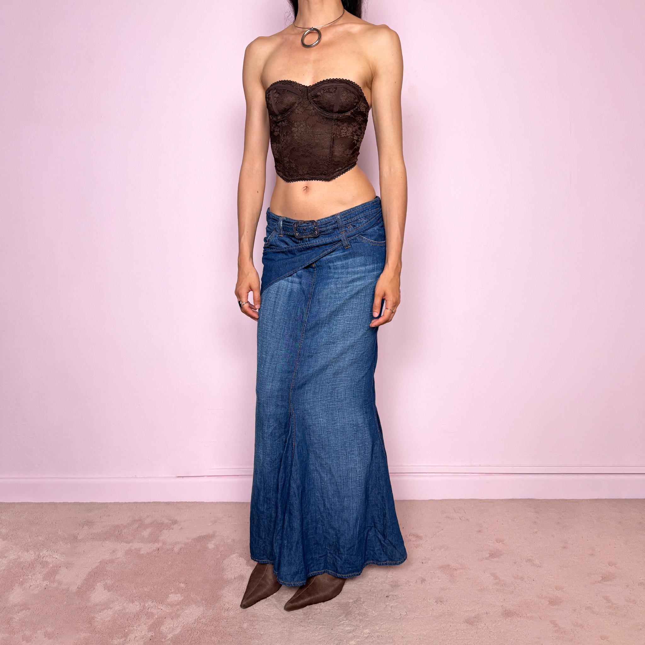 Vintage 2000s Jean’s Paul Gaultier blue denim mermaid maxi skirt made in Italy from a 68% cotton and 32% linen blend. Features a low rise, asymmetric belt detail, front zip closure, belt loops, and a dramatic flared mermaid godet-style hem. Designed with no stretch for a sculpted silhouette. A rare Y2K designer piece. Excellent vintage condition.
