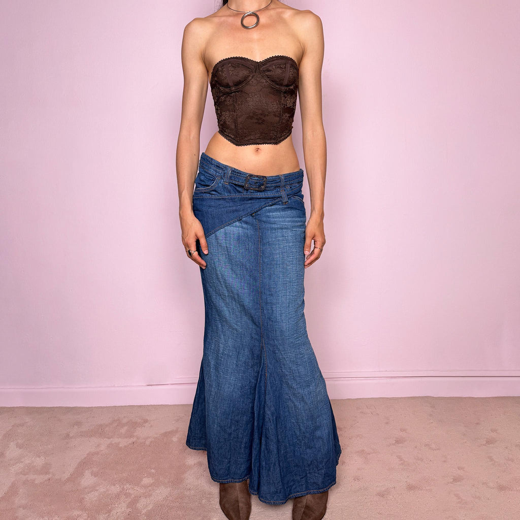 Vintage 2000s Jean’s Paul Gaultier blue denim mermaid maxi skirt made in Italy from a 68% cotton and 32% linen blend. Features a low rise, asymmetric belt detail, front zip closure, belt loops, and a dramatic flared mermaid godet-style hem. Designed with no stretch for a sculpted silhouette. A rare Y2K designer piece. Excellent vintage condition.