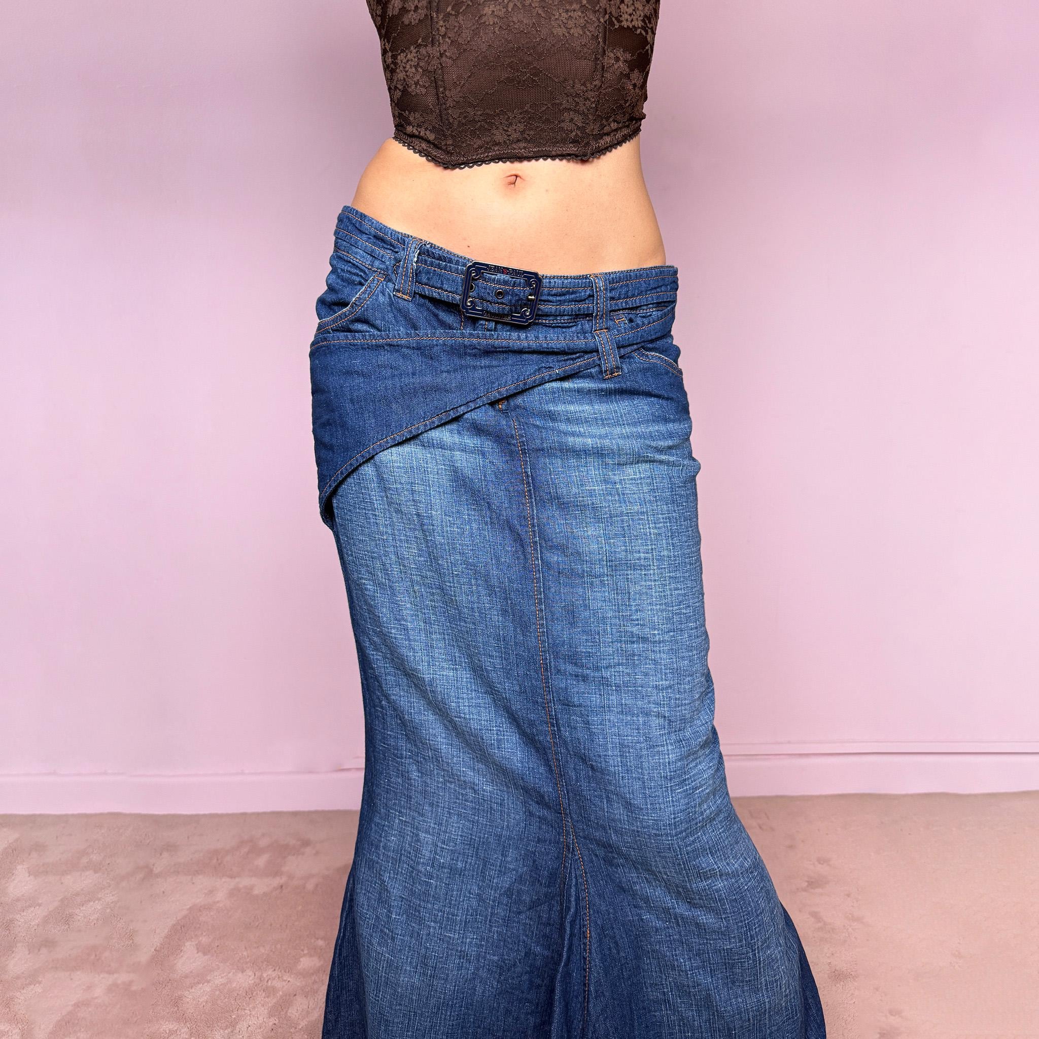 Vintage 2000s Jean’s Paul Gaultier blue denim mermaid maxi skirt made in Italy from a 68% cotton and 32% linen blend. Features a low rise, asymmetric belt detail, front zip closure, belt loops, and a dramatic flared mermaid godet-style hem. Designed with no stretch for a sculpted silhouette. A rare Y2K designer piece. Excellent vintage condition.