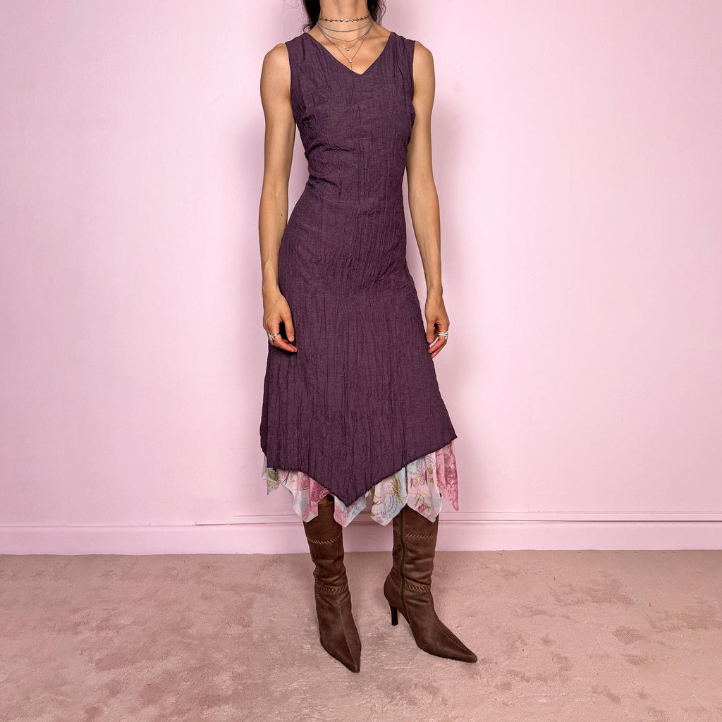 Vintage 2000s purple sleeveless midi dress with a minimal avant-garde look, no stretch, V-neckline, crinkle texture, flowy fit, side zip closure, and an asymmetric hem with graphic print mesh ruffle detail. Made by a French brand from a polyester viscose blend. Great vintage condition.