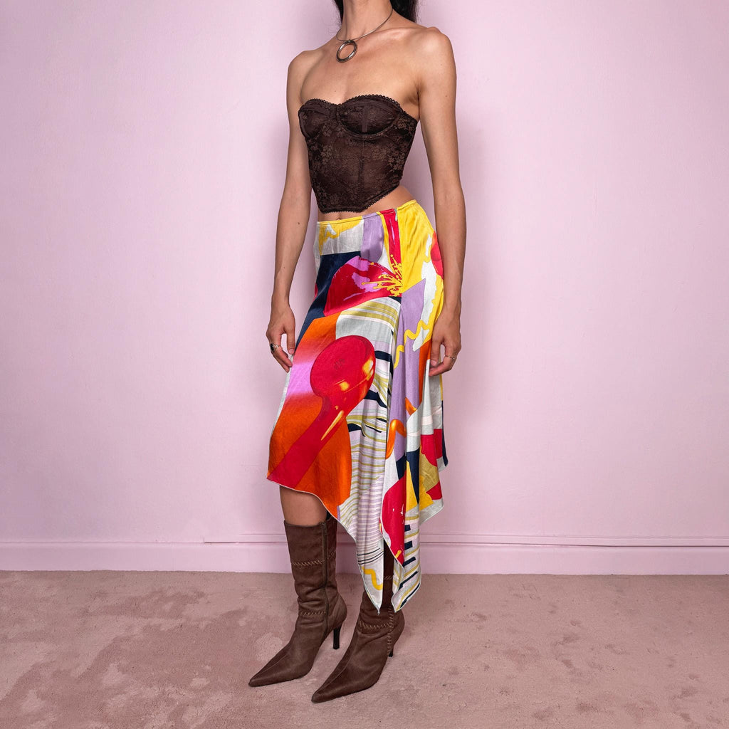 Vintage 2000s Christian Lacroix Bazar asymmetric skirt made in France from 100% silk. Features a bold multicolor abstract print, side zip closure, no stretch, and a beautiful asymmetric draped hem. A rare designer statement piece with an artistic Y2K resort feel, perfect for elevated summer looks. Can be worn high-waisted for size S or lower-rise for XS.