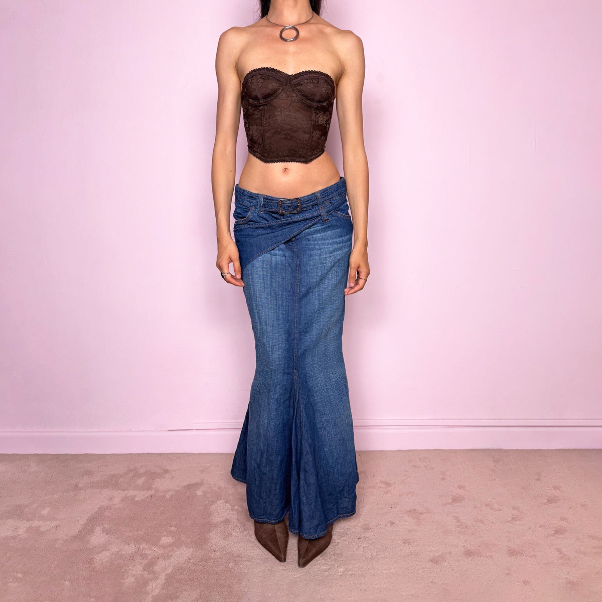 Vintage 2000s Jean’s Paul Gaultier blue denim mermaid maxi skirt by French designer Jean Paul Gaultier, made in Italy from a 68% cotton and 32% linen blend. Features a low-rise silhouette, asymmetric belt detail, front zip closure, belt loops, and a dramatic flared mermaid godet-style hem. Designed with no stretch for a sculpted silhouette. Excellent vintage condition.