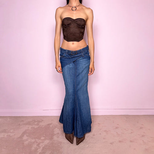 Vintage 2000s Jean’s Paul Gaultier blue denim mermaid maxi skirt by French designer Jean Paul Gaultier, made in Italy from a 68% cotton and 32% linen blend. Features a low-rise silhouette, asymmetric belt detail, front zip closure, belt loops, and a dramatic flared mermaid godet-style hem. Designed with no stretch for a sculpted silhouette. Excellent vintage condition.