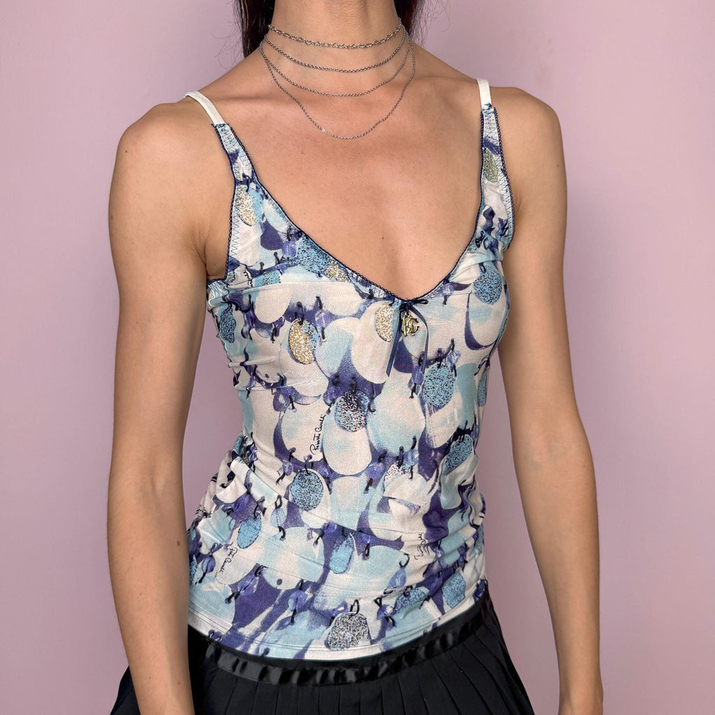 Vintage 2000s Roberto Cavalli Underwear cami top in a delicate blue and white abstract print with a fitted stretchy silhouette, contrast trims, and a signature gold-tone Cavalli charm at the front. Made from a 75% polyamide and 25% elastane blend, with a flattering V neckline and thin straps. A sensual, dreamy Y2K piece for lingerie-as-outerwear and refreshing summer looks. Excellent vintage condition.