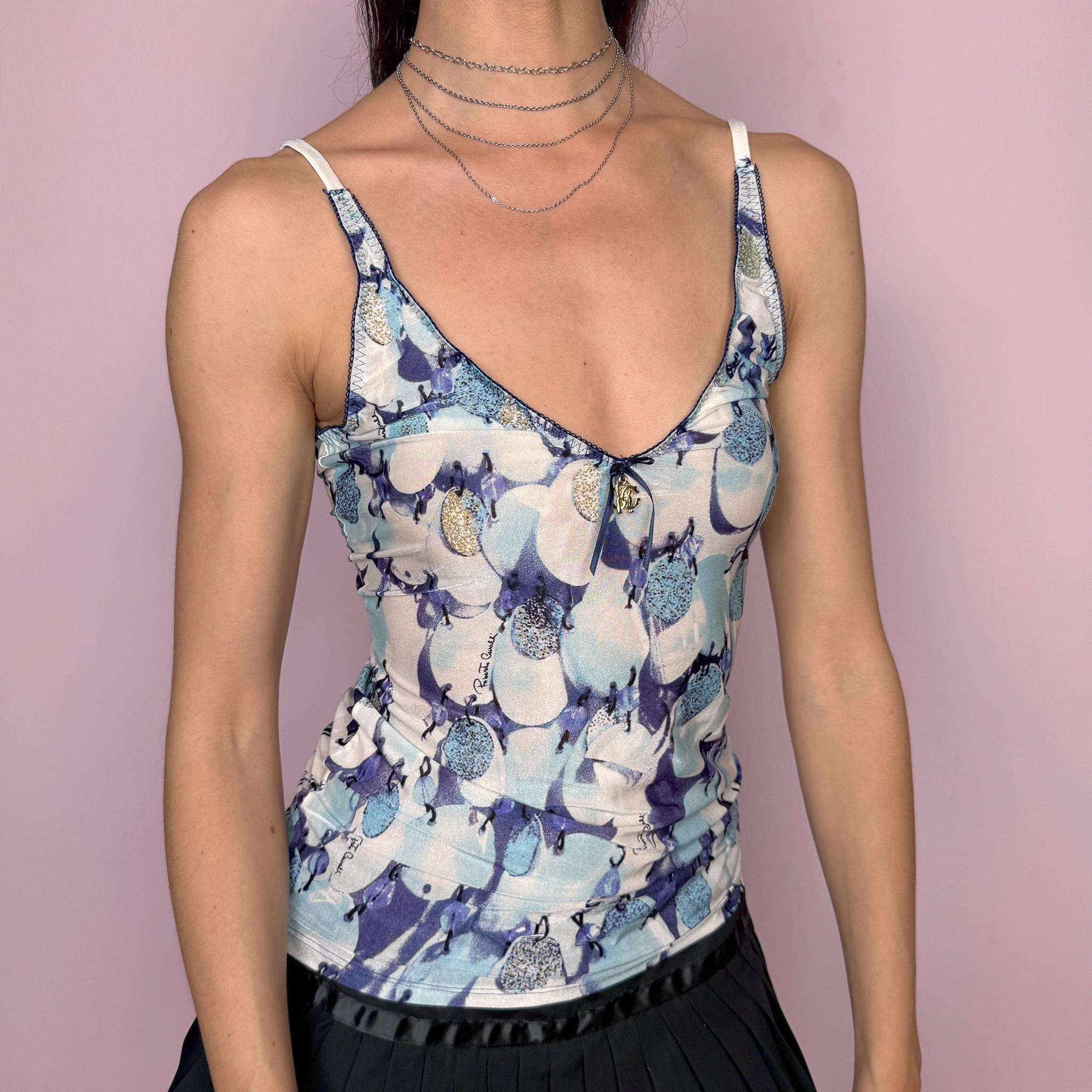 Vintage 2000s Roberto Cavalli Underwear cami top in a delicate blue and white abstract print with a fitted stretchy silhouette, contrast trims, and a signature gold-tone Cavalli charm at the front. Made from a 75% polyamide and 25% elastane blend, with a flattering V neckline and thin straps. A sensual, dreamy Y2K piece for lingerie-as-outerwear and refreshing summer looks. Excellent vintage condition.