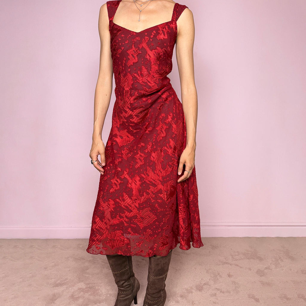 Vintage 2000s red and burgundy flared midi dress in a rich textured fabric with a semi-sheer abstract effect throughout and wide shoulder straps. The deep red tone and texture give the piece a romantic 90s / early 2000s evening feel, perfect for date nights and special occasions. Made from non-stretch polyester. Excellent vintage condition.