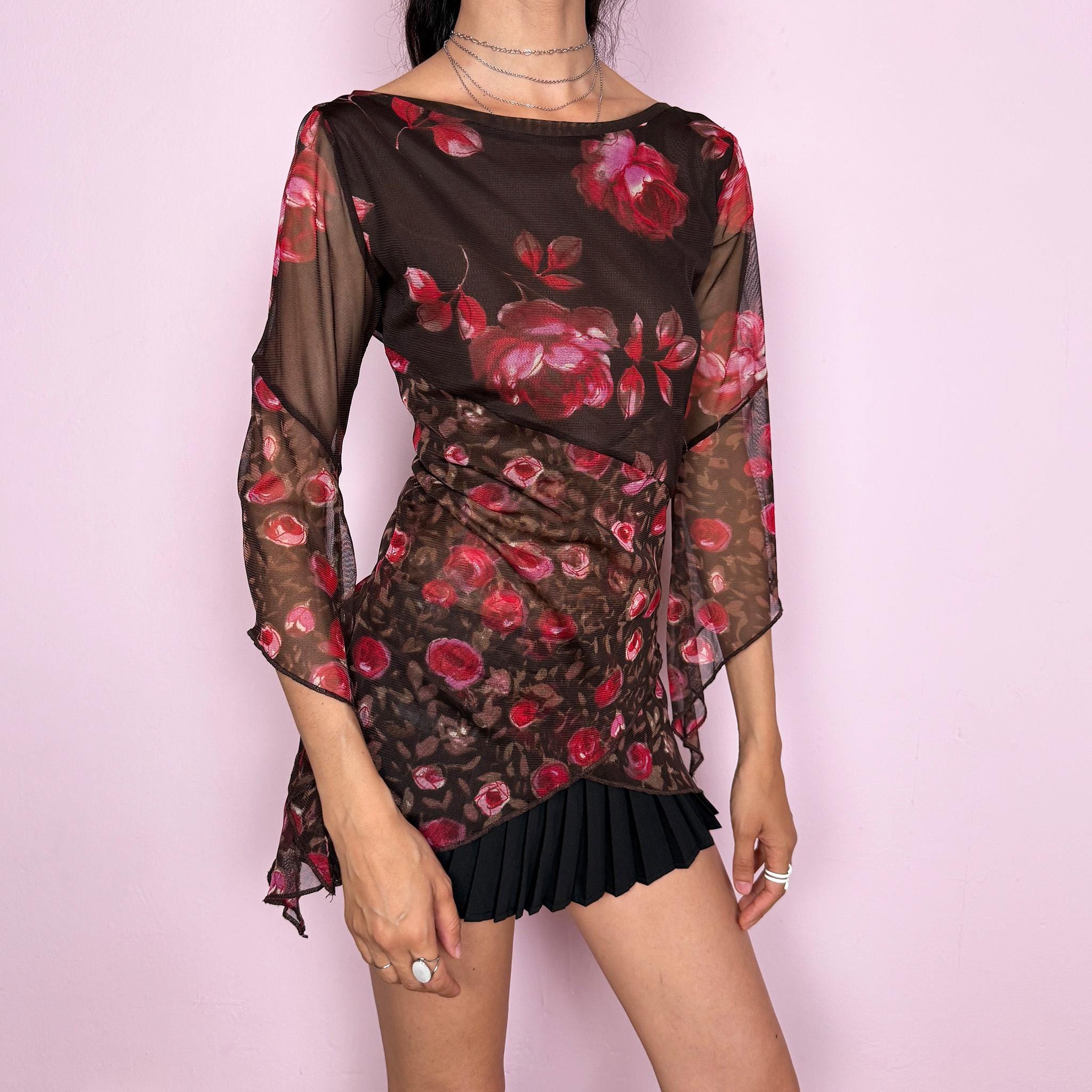 Vintage 2000s brown sheer mesh top with a fitted stretchy silhouette, asymmetric draped layered construction, wide boat neckline, and 3/4 bell sleeves. Red and pink floral rose print gives a romantic fairycore Y2K statement look. From a French brand. Fabric composition label is missing. Excellent vintage condition.