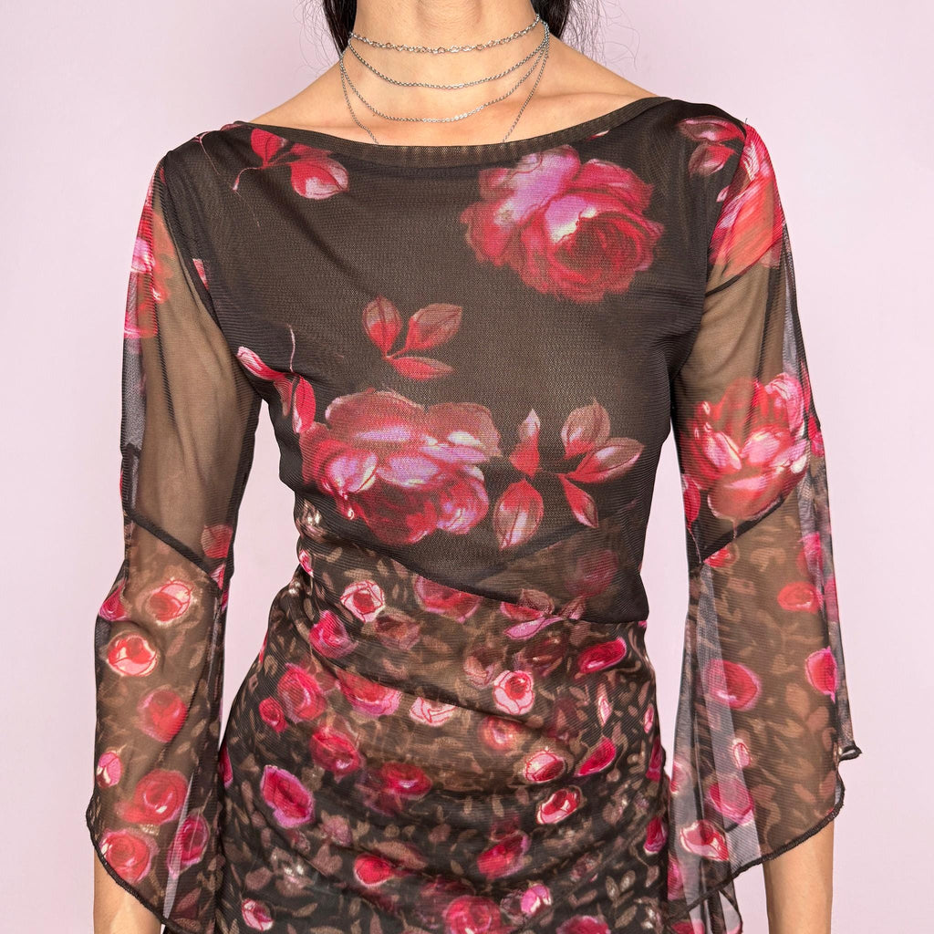 Vintage 2000s brown sheer mesh top with a fitted stretchy silhouette, asymmetric draped layered construction, wide boat neckline, and 3/4 bell sleeves. Red and pink floral rose print gives a romantic fairycore Y2K statement look. From a French brand. Fabric composition label is missing. Excellent vintage condition.