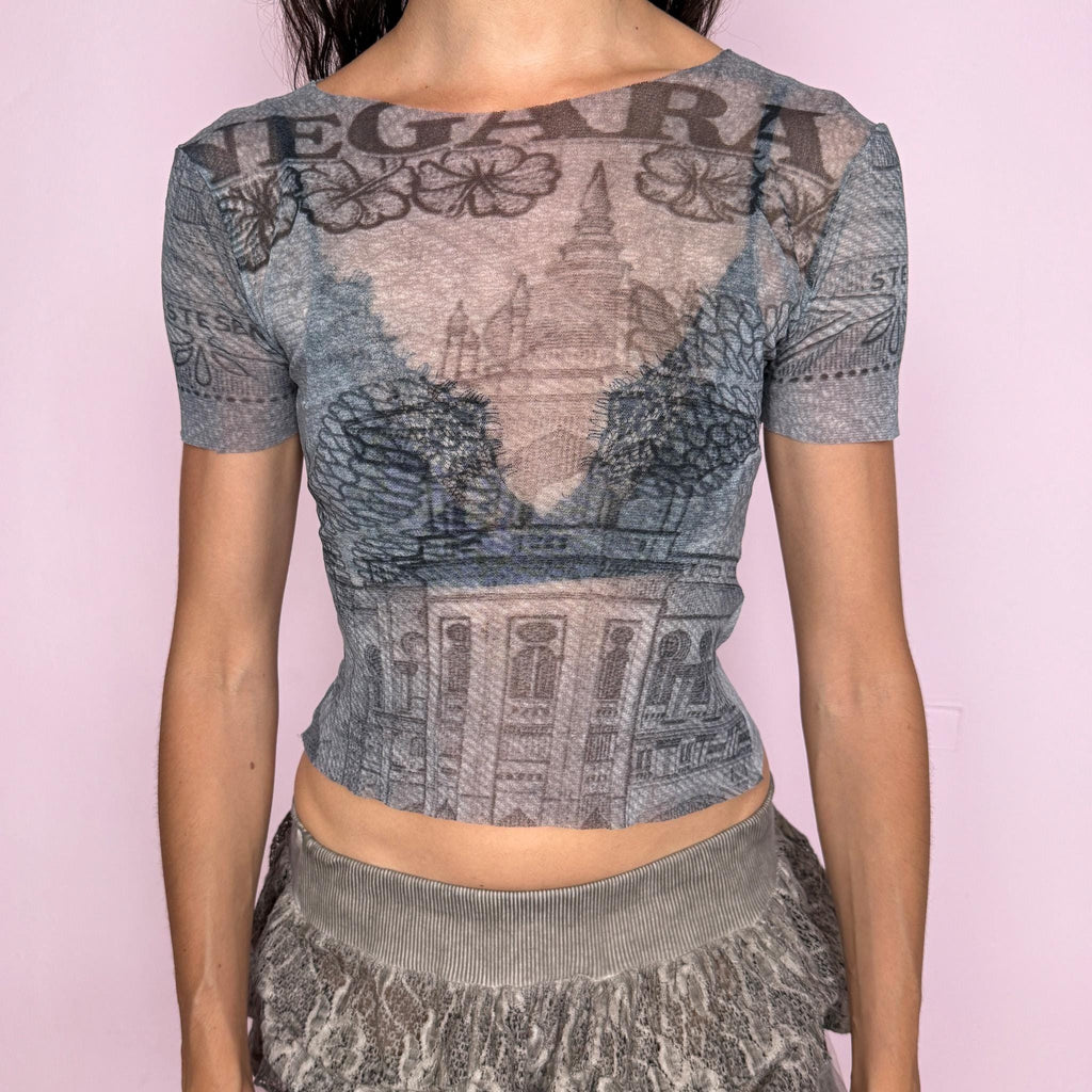 Vintage 2000s semi-sheer mesh top in soft grey tones with an architectural graphic print, fitted second-skin silhouette, short sleeves, wide neckline, and raw-edge finish. Lightweight, stretchy, slightly transparent, and futuristic with a deconstructed Y2K look. By Italian brand Gazebo, fabric composition unknown due to missing label. Excellent vintage condition.