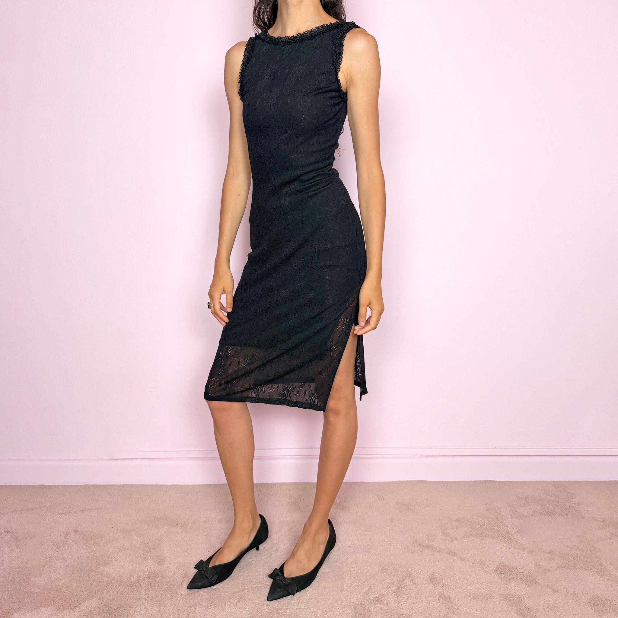 Vintage 2000s Moschino Jeans black lace stretch midi dress, made in Italy from polyamide fabric with a fitted body-skimming silhouette. Designed with a sleeveless cut, delicate textured floral pattern, and a side slit for movement. Features soft ruffle-style trim along the neckline and arm openings. A romantic Italian designer Y2K piece, perfect for a sleek, minimal, elegant evening look. Excellent vintage condition.