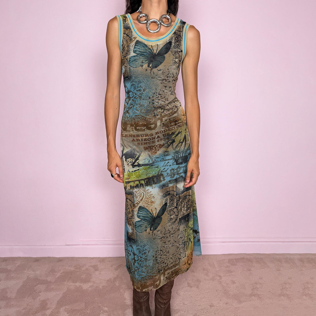 Vintage 2000s fitted sleeveless midi dress in lightweight stretch mesh with matching mesh lining for a softly sheer layered effect. Features blue, green and brown butterfly graphics, faded architectural motifs, postcard-style typography and contrast trim, with a visual Y2K art-to-wear feel for maximalist editorial styling. Made in France by a French brand. Excellent vintage condition.