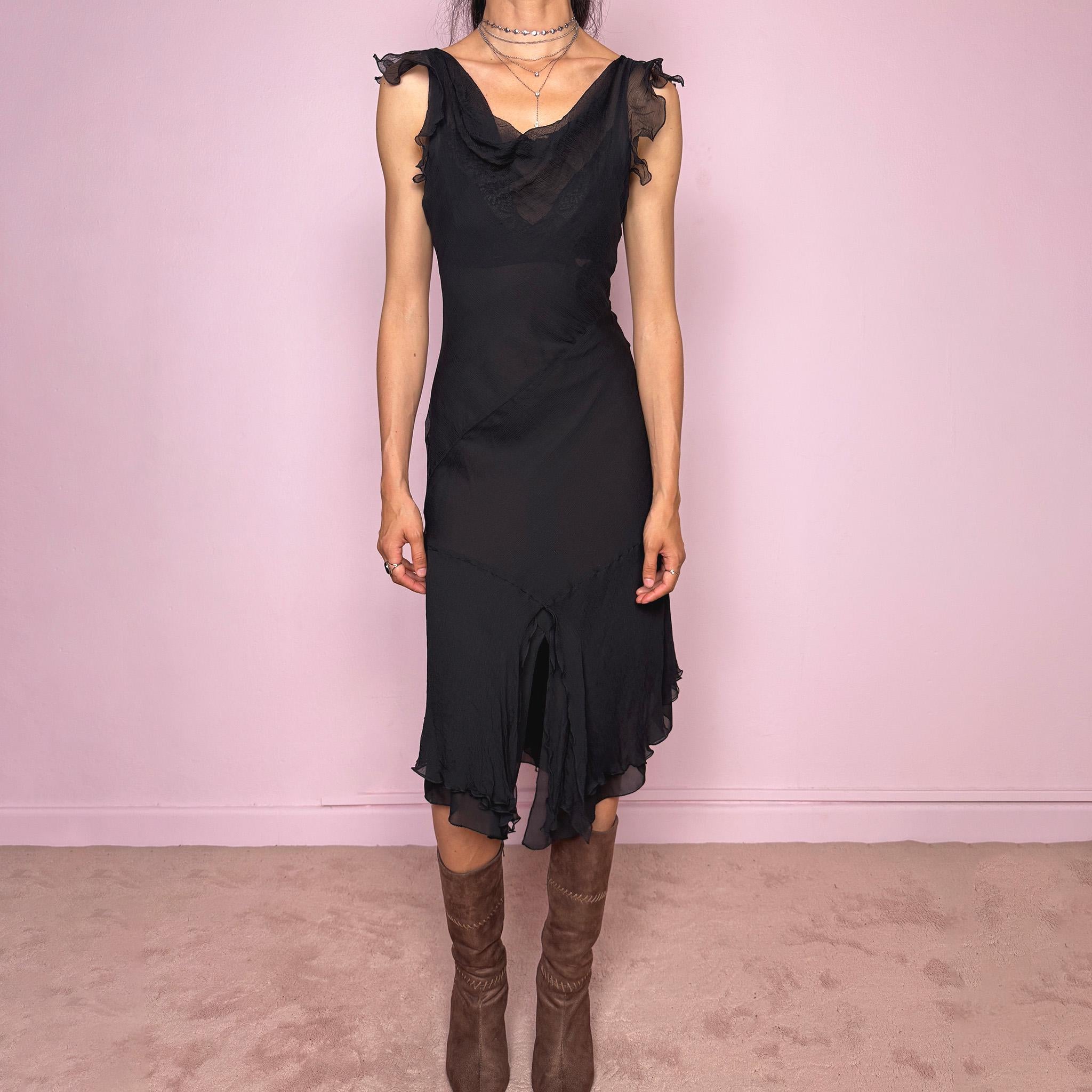 Vintage 2000s black midi dress with a romantic draped silhouette and semi-sheer layered construction. Designed with a cowl-style neckline, delicate ruffled cap sleeves, fitted waist, front slit detail, and fluid layered asymmetrical hem for an elegant dark evening look. The outer layer looks and feels like silk, but all labels are missing, so the exact fabric composition is unknown. Excellent vintage condition.
