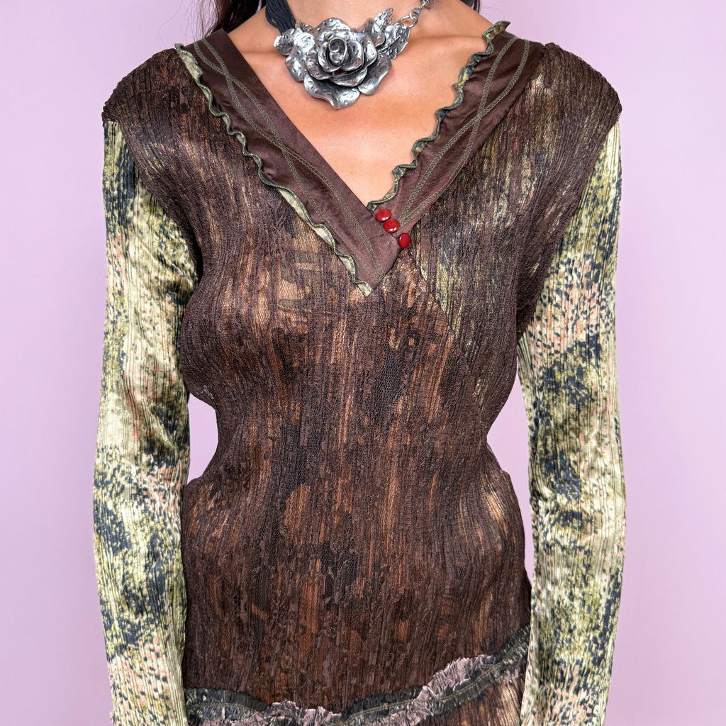 Vintage 2000s fitted long sleeve top in pleated stretch fabric with earthy brown, olive and muted green tones. Features contrasting printed sleeves, a layered V neckline, asymmetric hem and textured lace trim. Ideal for earthy fairy, bohemian and deconstructed Y2K outfits. From a French brand, 100% polyester. Excellent vintage condition.