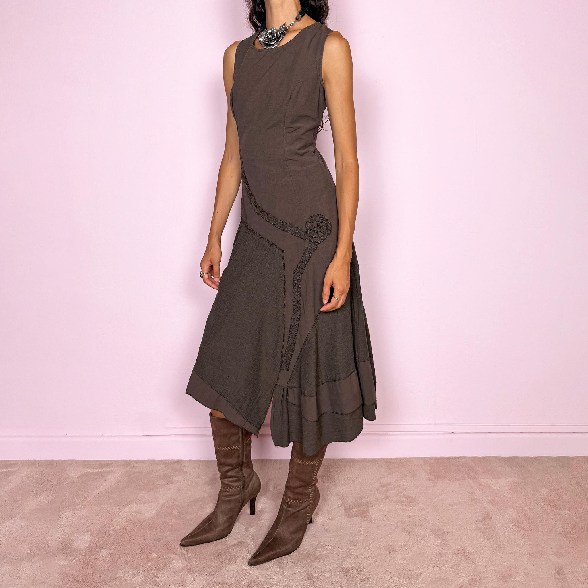 Vintage 2000s brown asymmetric midi dress featuring a sleeveless silhouette with sculptural panel construction, mixed tonal textures, and ruffled trim creating an organic, deconstructed effect across the body. Finished with an irregular asymmetric hem and back zip closure. No stretch. Made in France by a French brand from 61% viscose and 39% polyester.